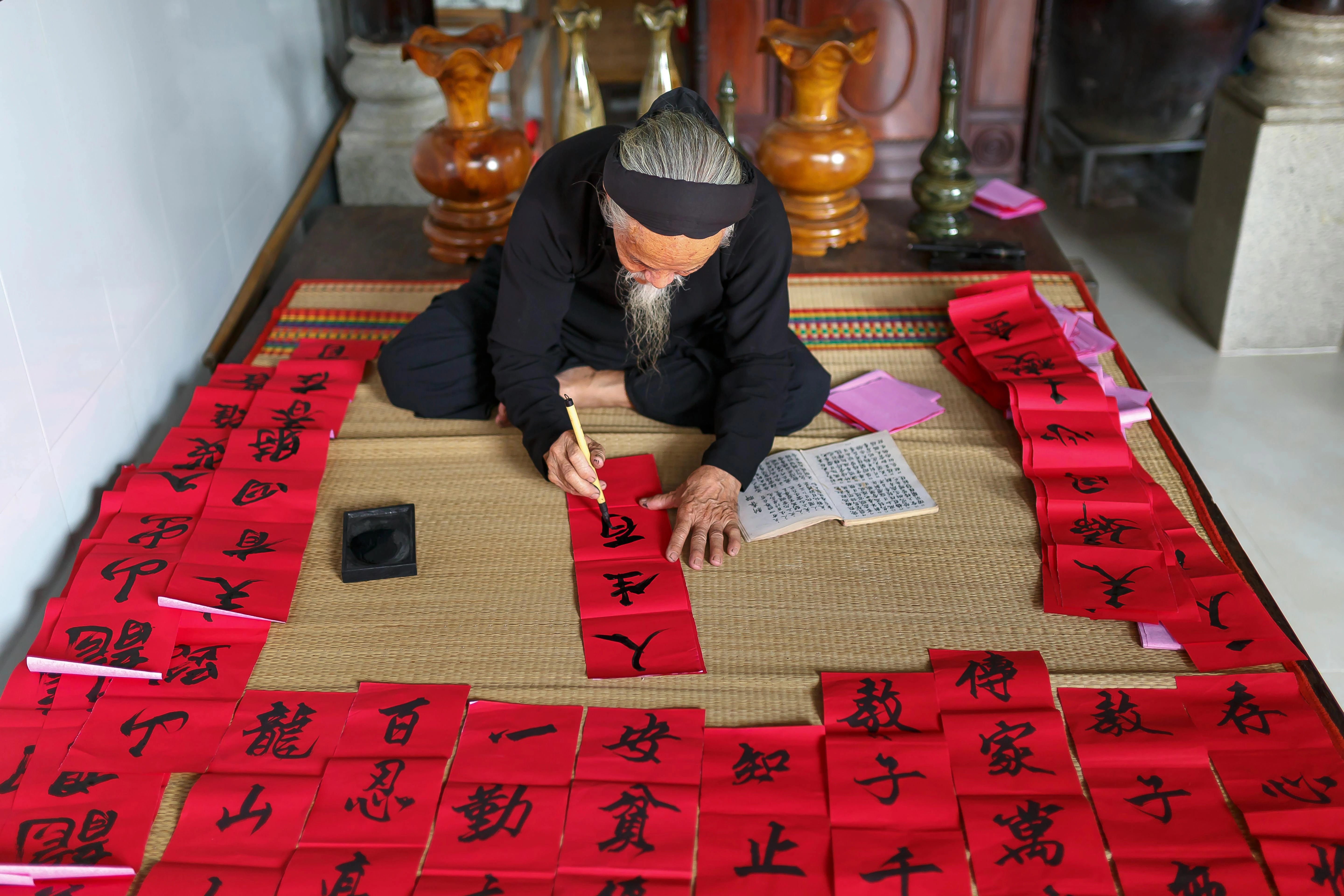 Calligrapher creating Lunar decorations