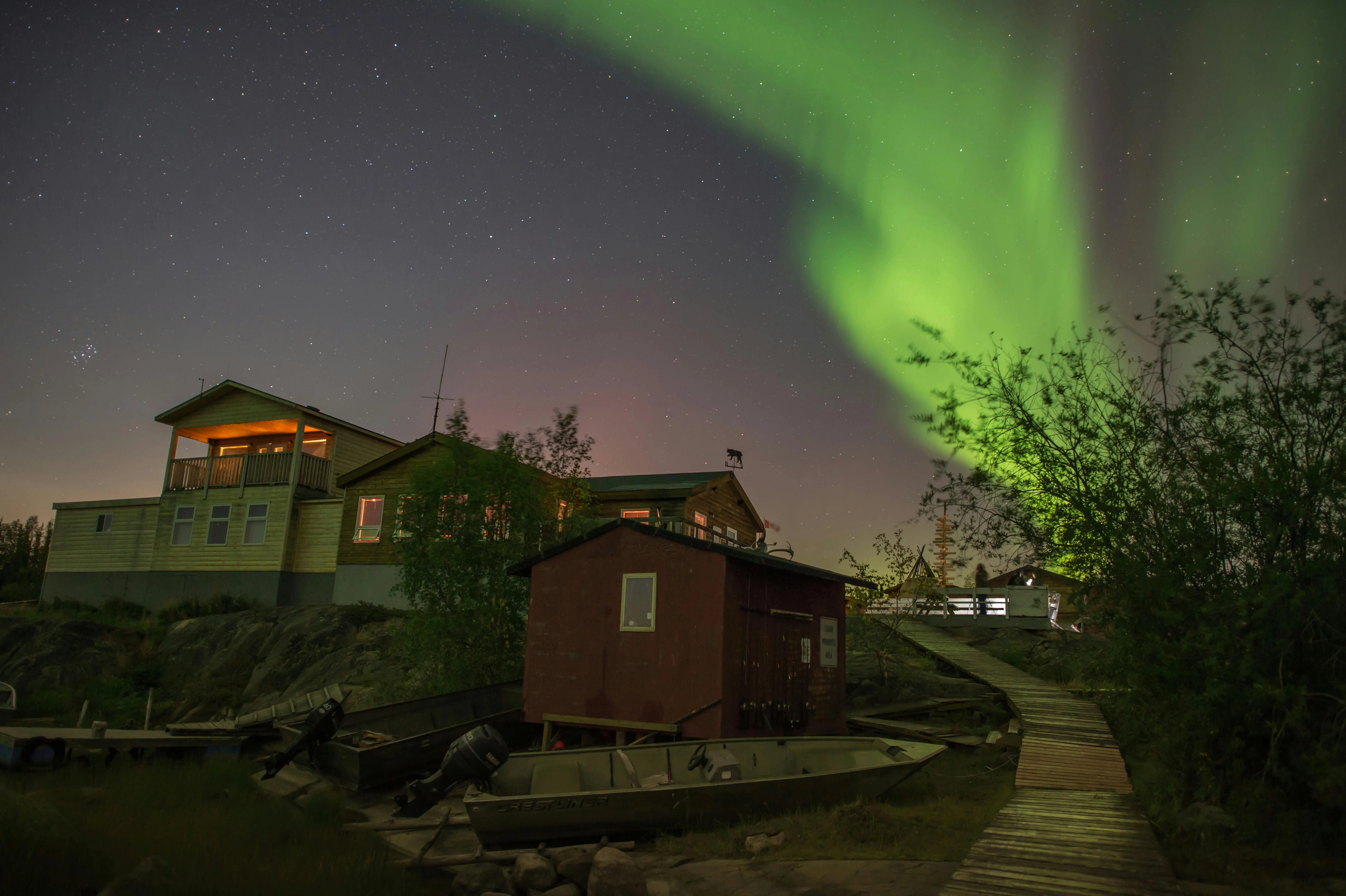 Aurora Over Lakeside Cabin