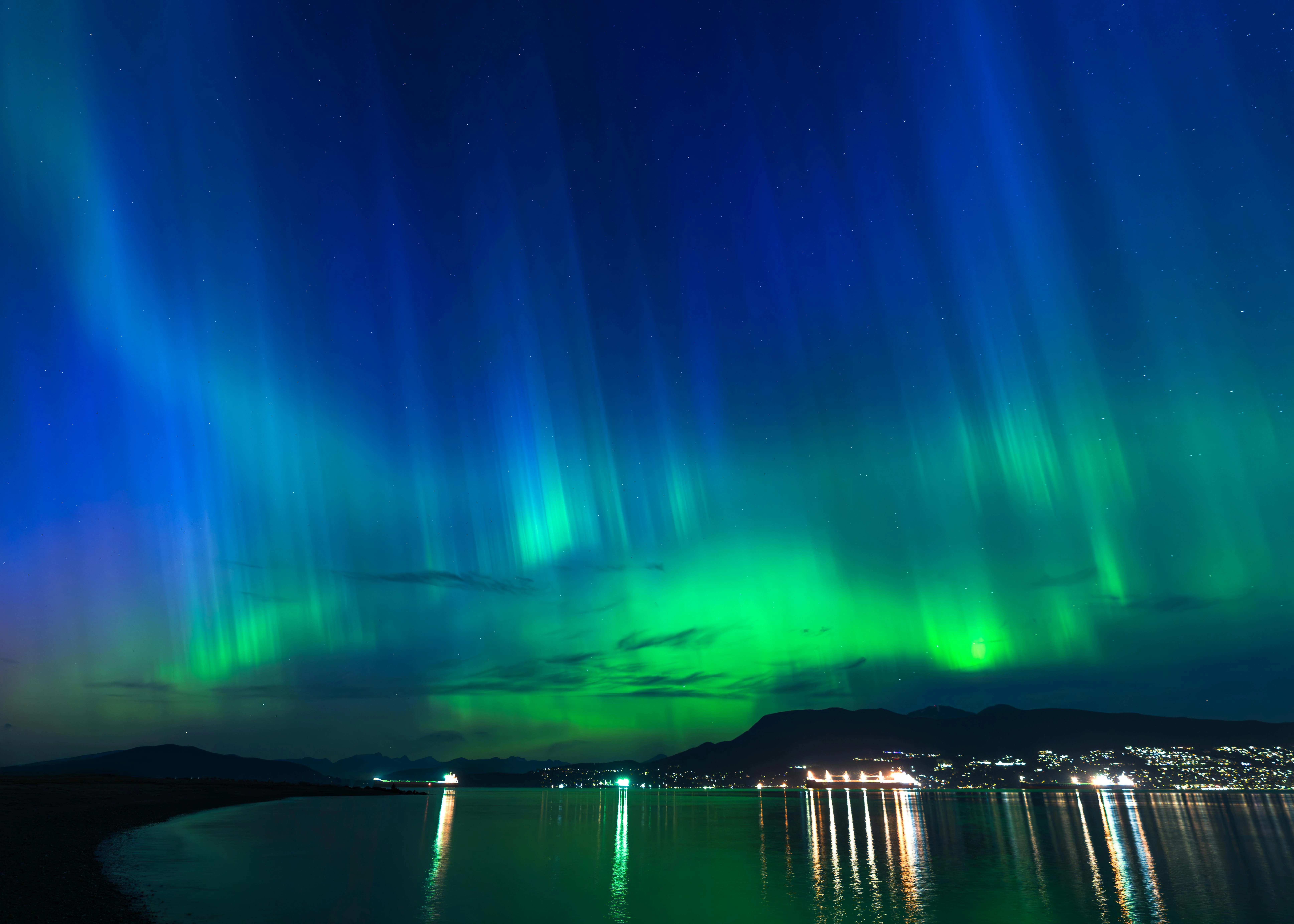Northern Lights Over City