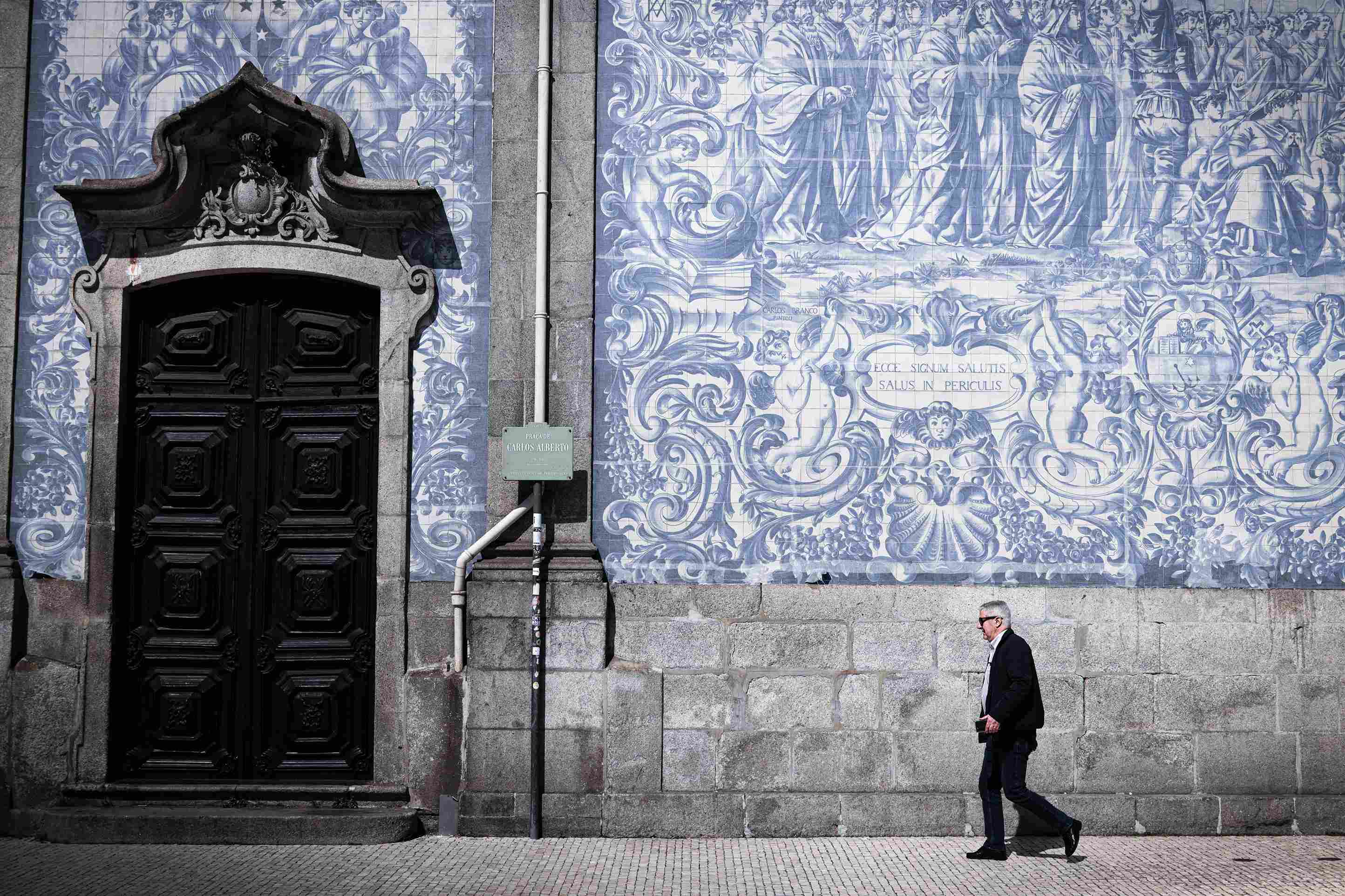 Ornate Azulejo Facade and Passerby Ornate Azulejo Facade and Passerby