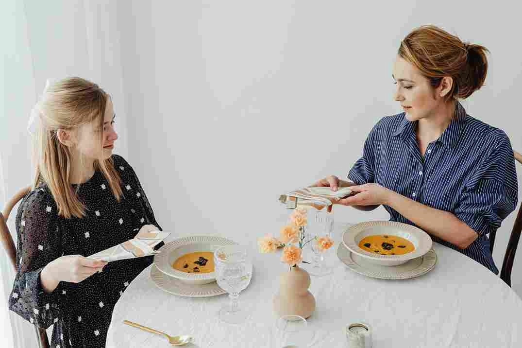 Friends dining over soup