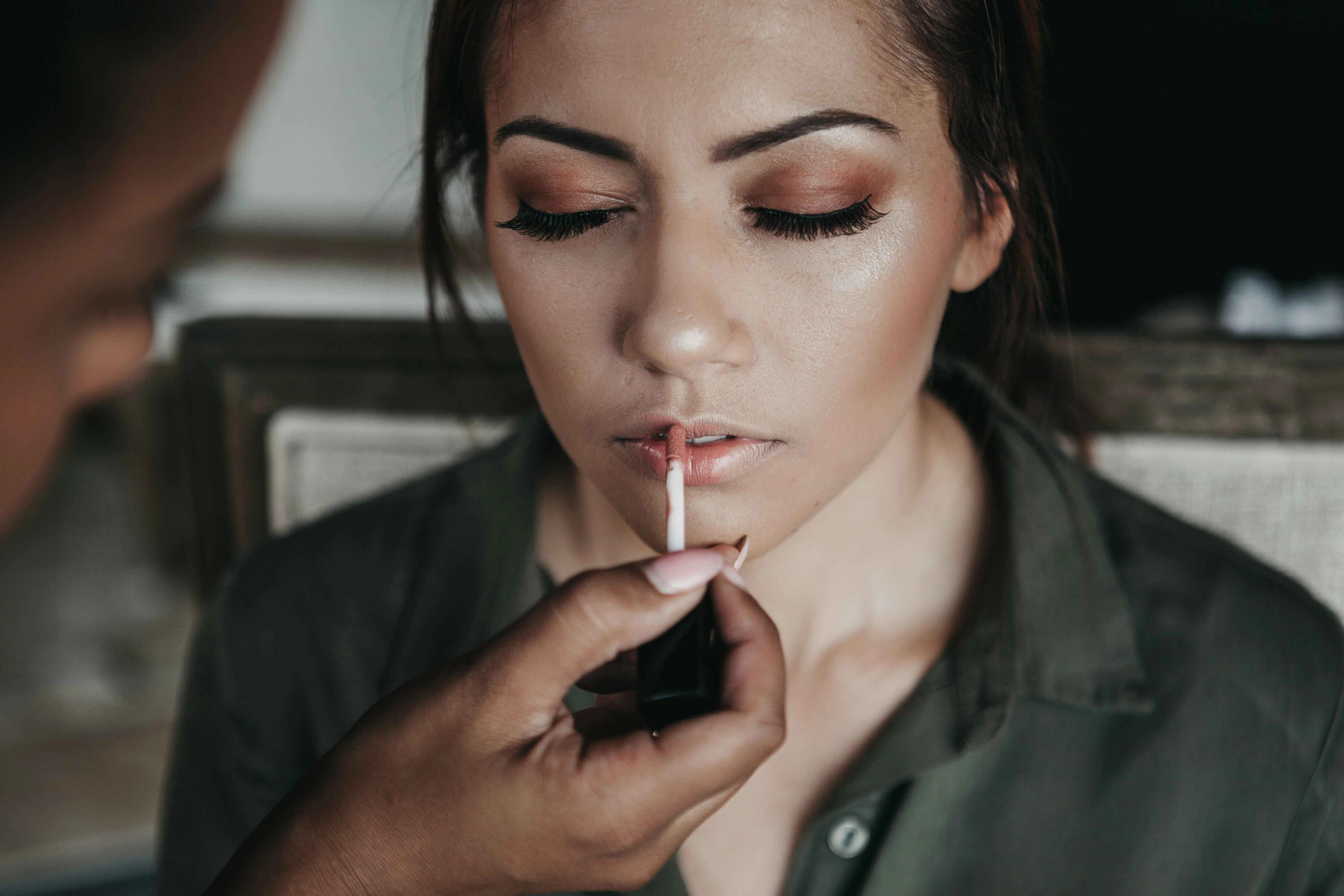 Makeup Artist Applying Lip Color