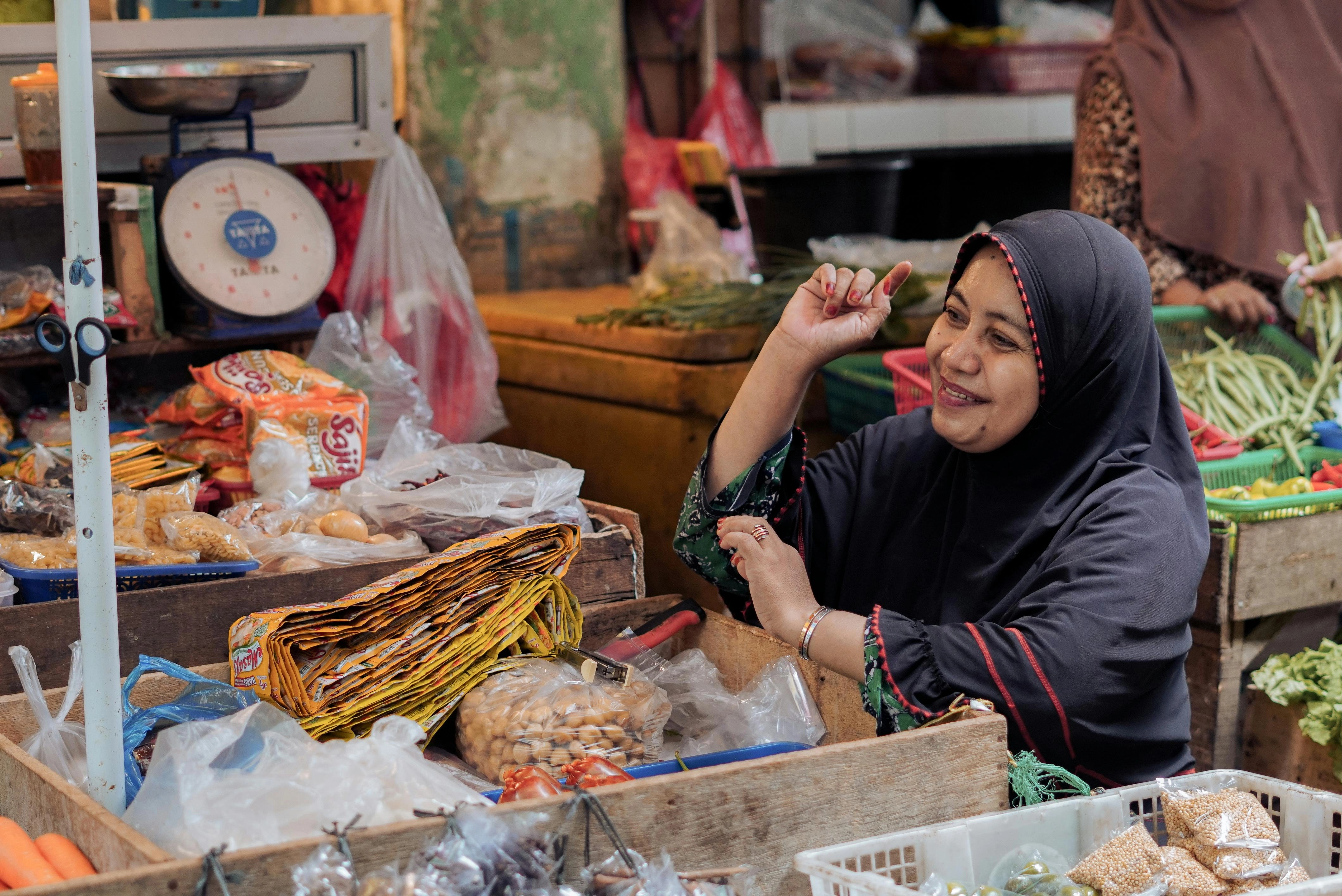 Market Vendor's Cheerful Interaction