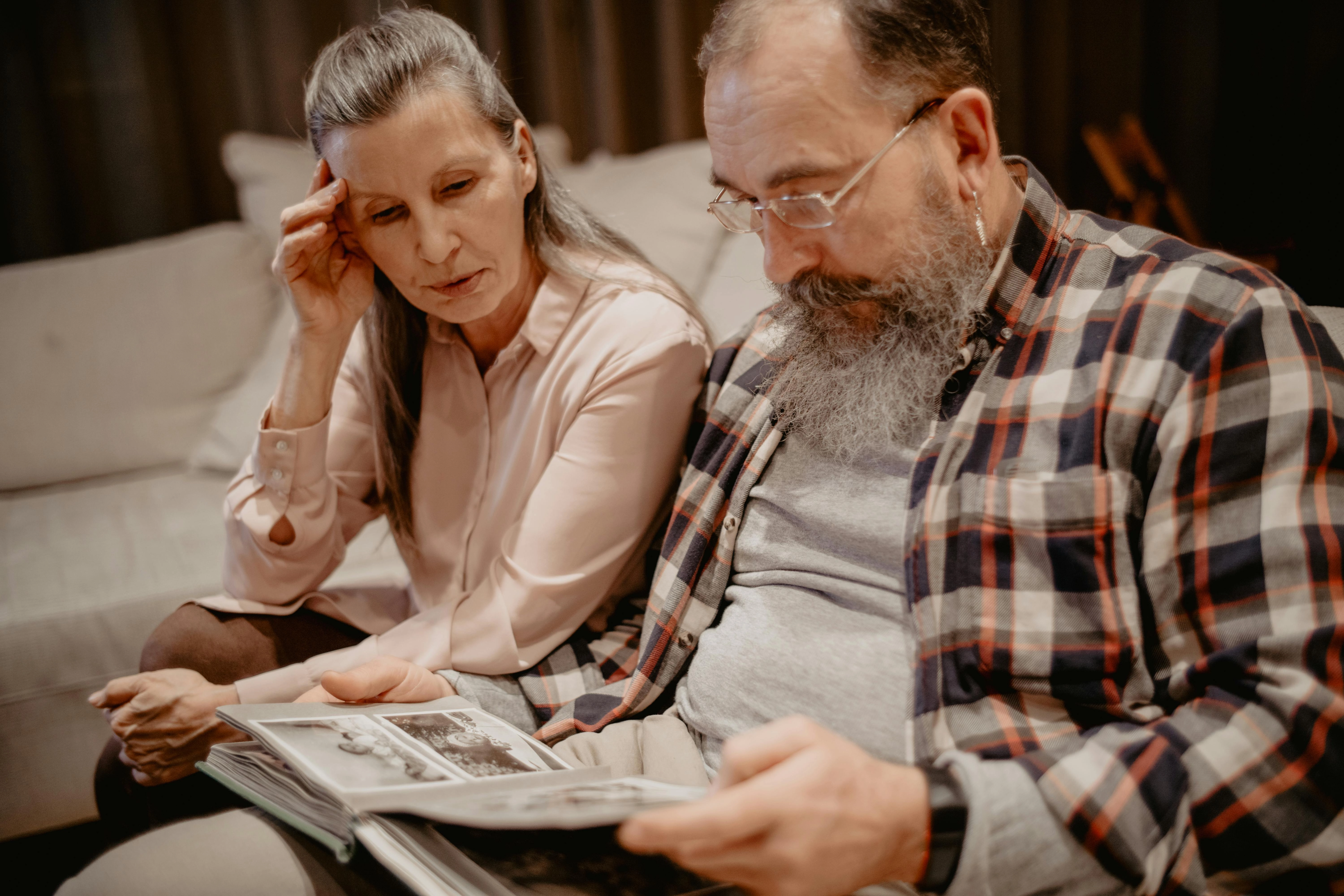 Nostalgic Couple Viewing Photos