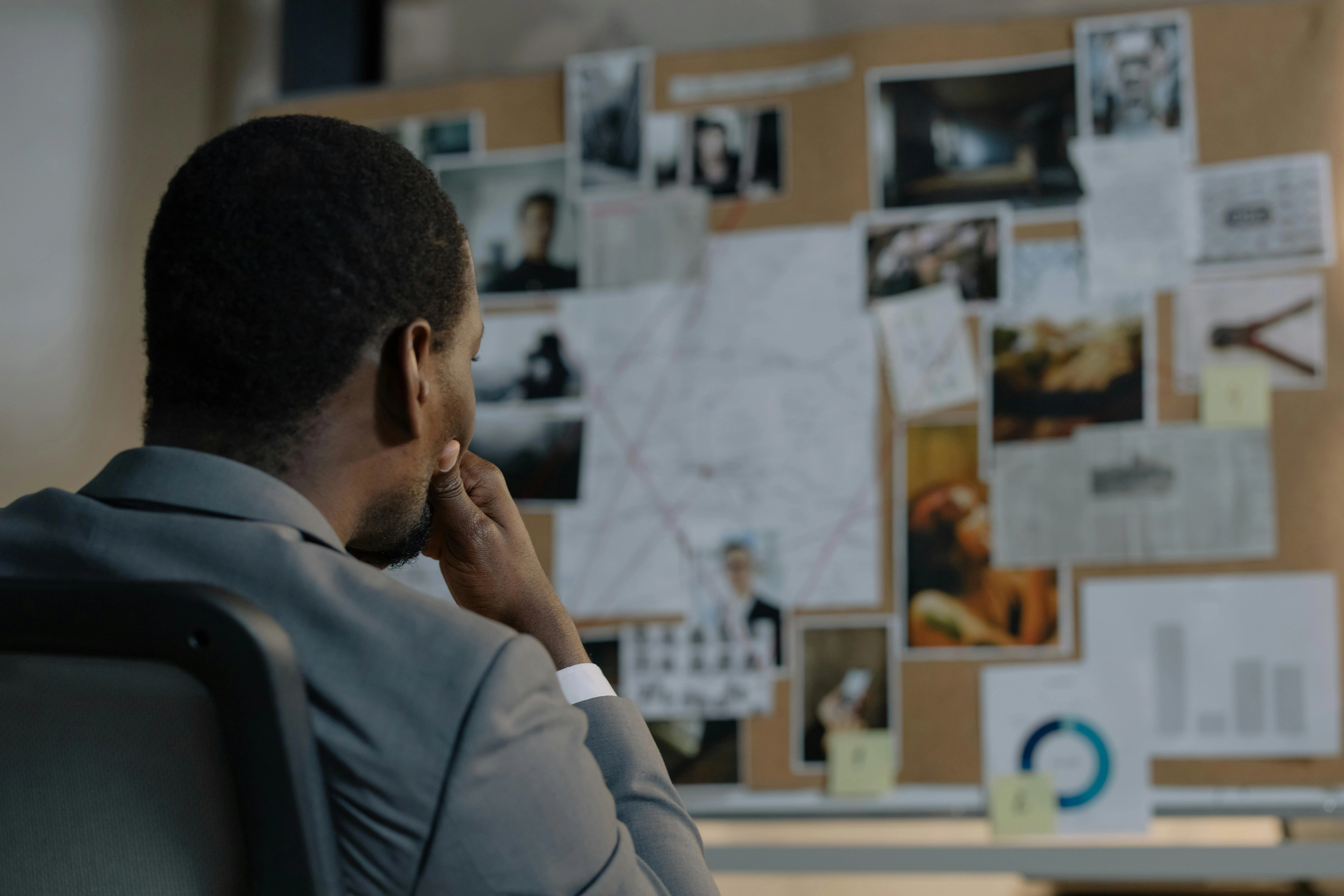Detective Analyzing Evidence Board