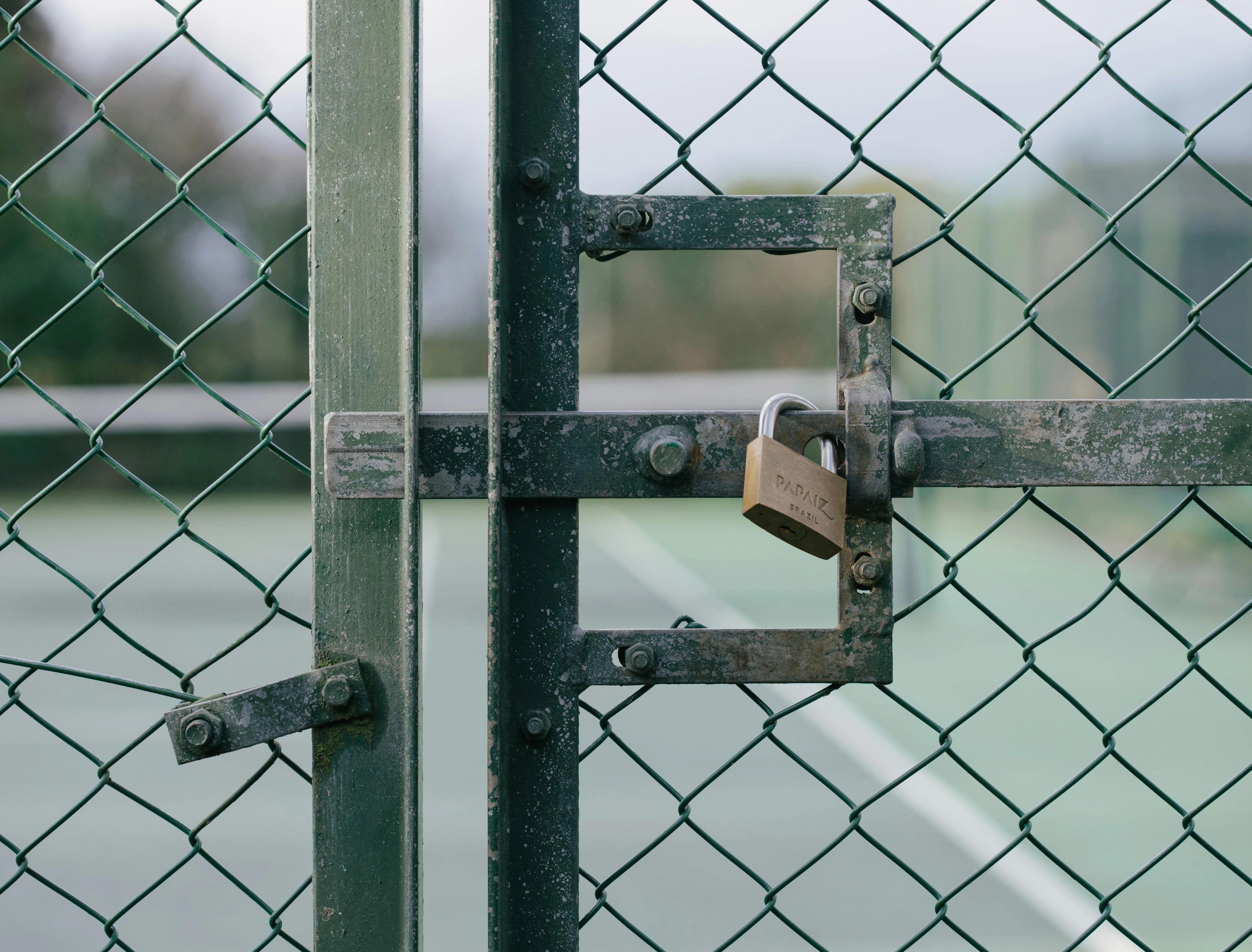 Locked Chain-Link Gate Close-up Locked Chain-Link Gate Close-up