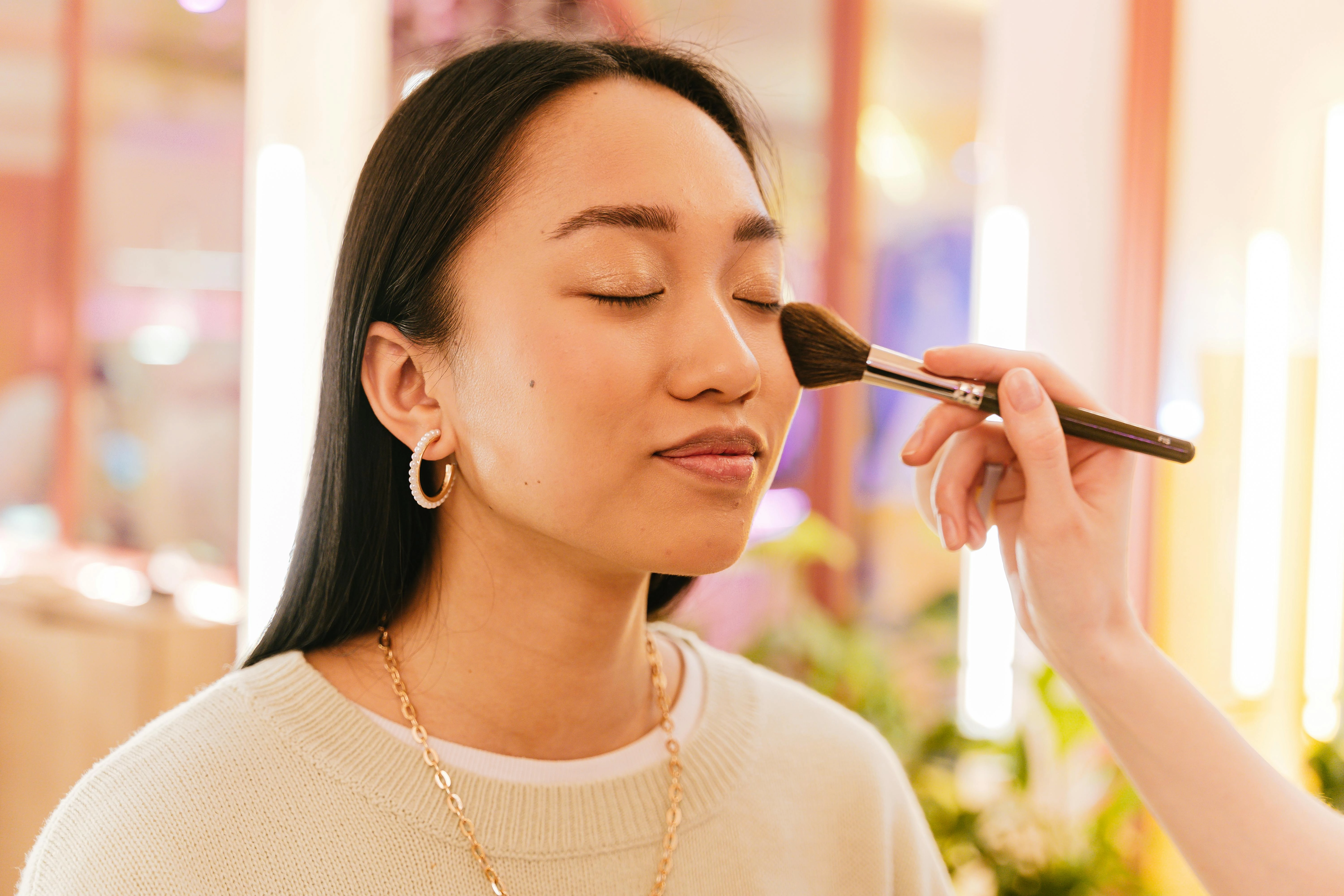 Makeup Application in Pastel Setting