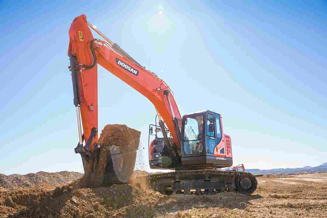 Orange excavator in desert