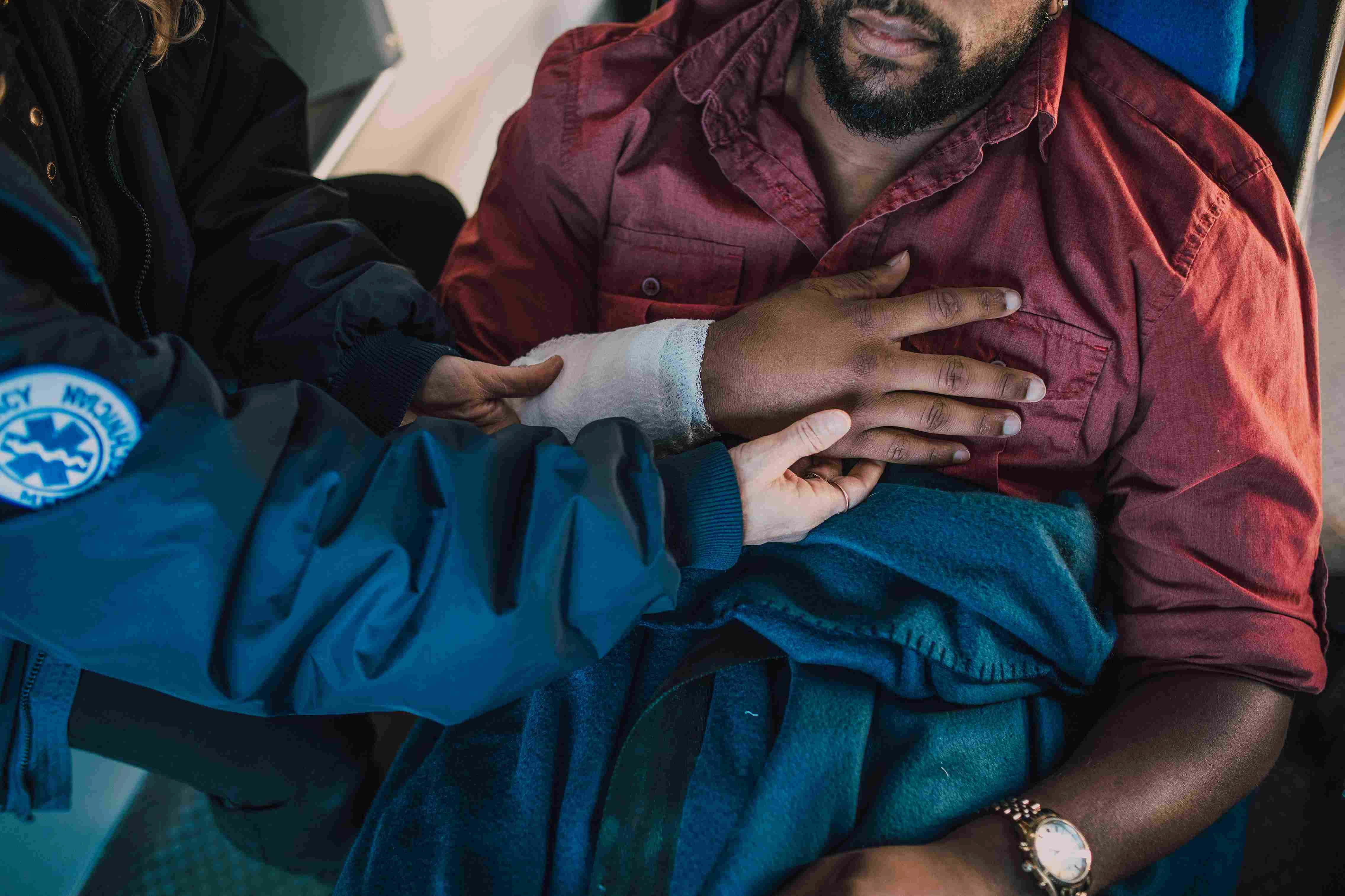 Paramedic Treats Injured Man
