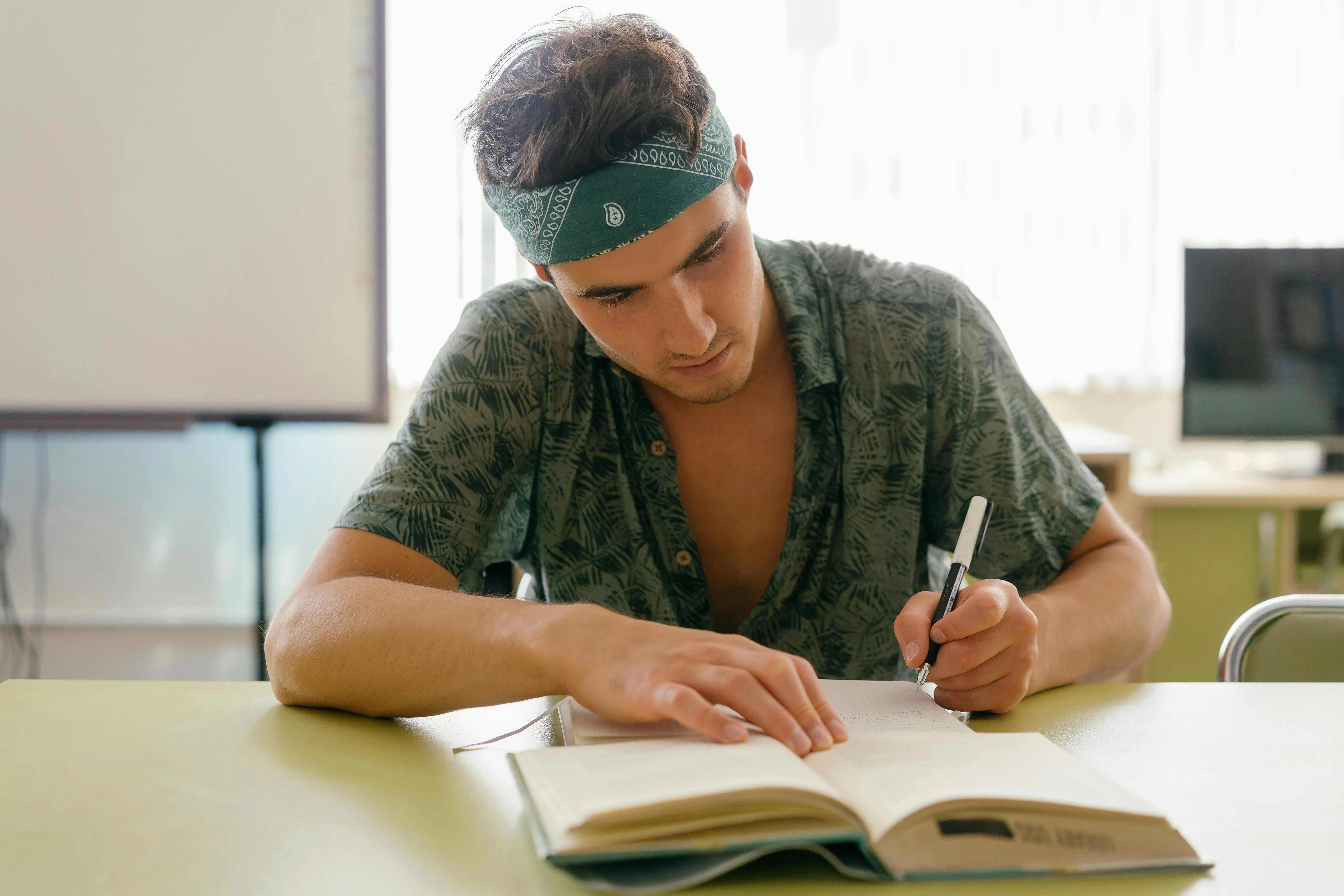 Student Writing in Notebook