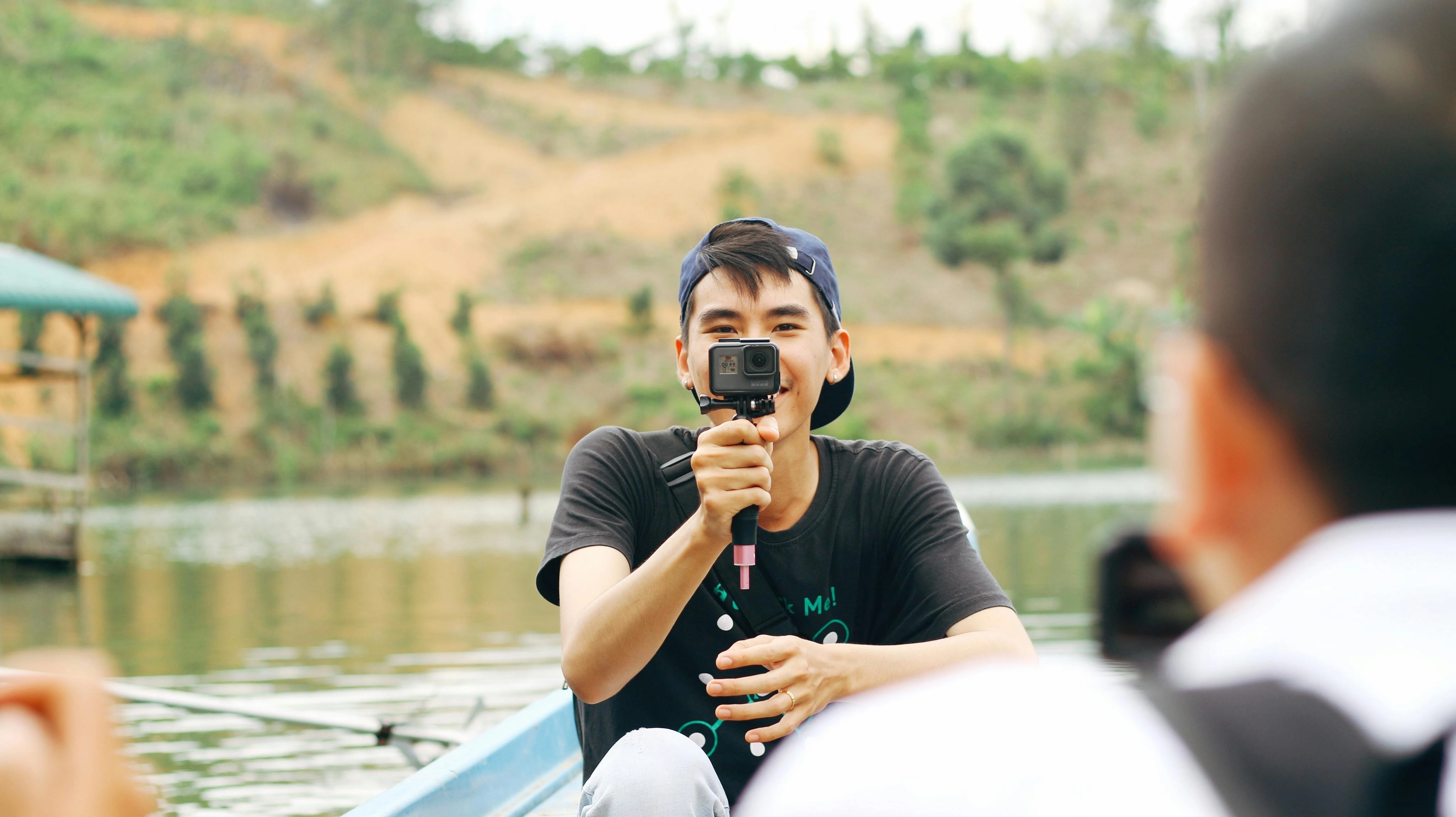 Vlogger filming outdoor adventure Vlogger filming outdoor adventure