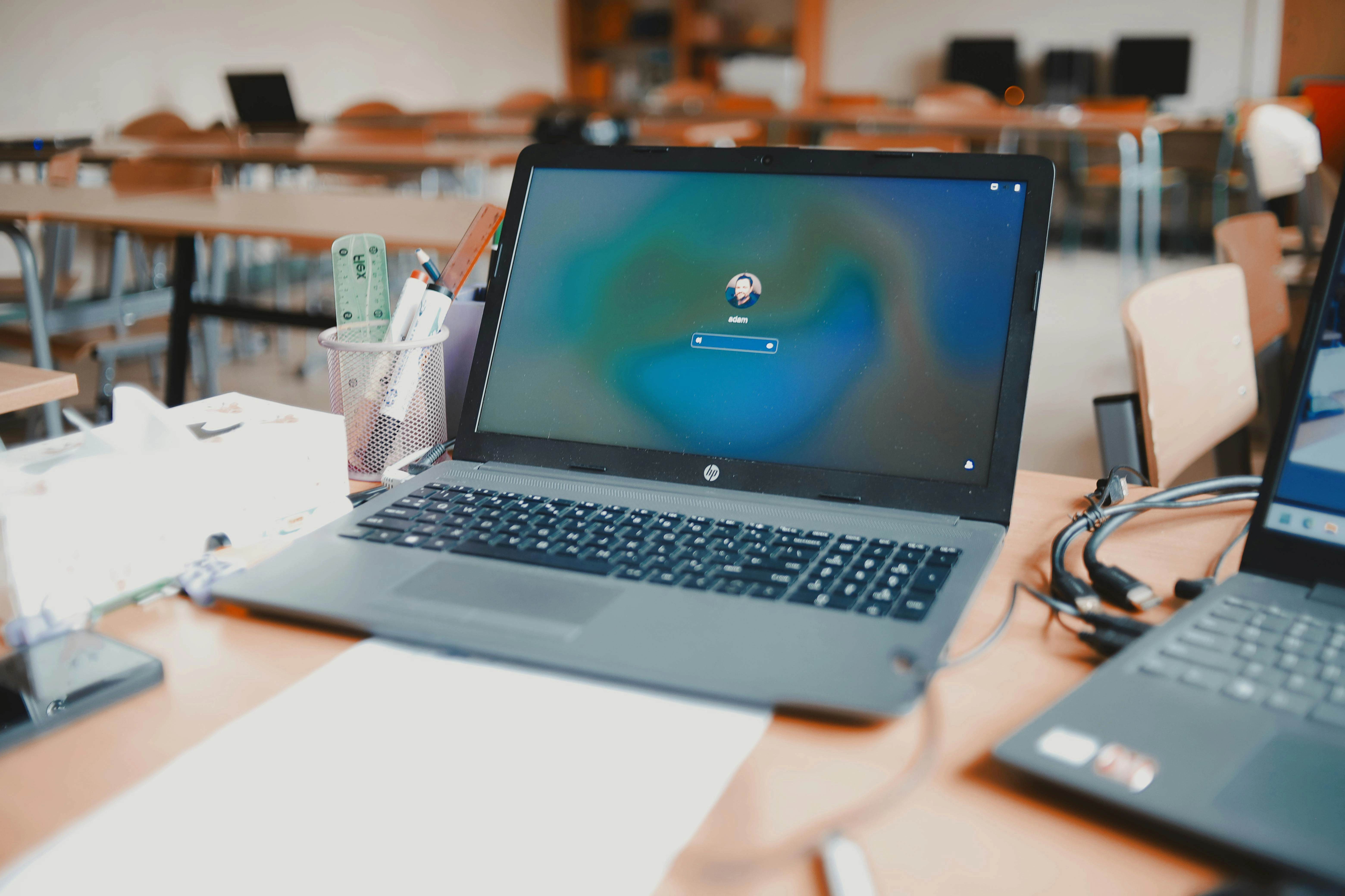 Laptop on classroom desk Laptop on classroom desk