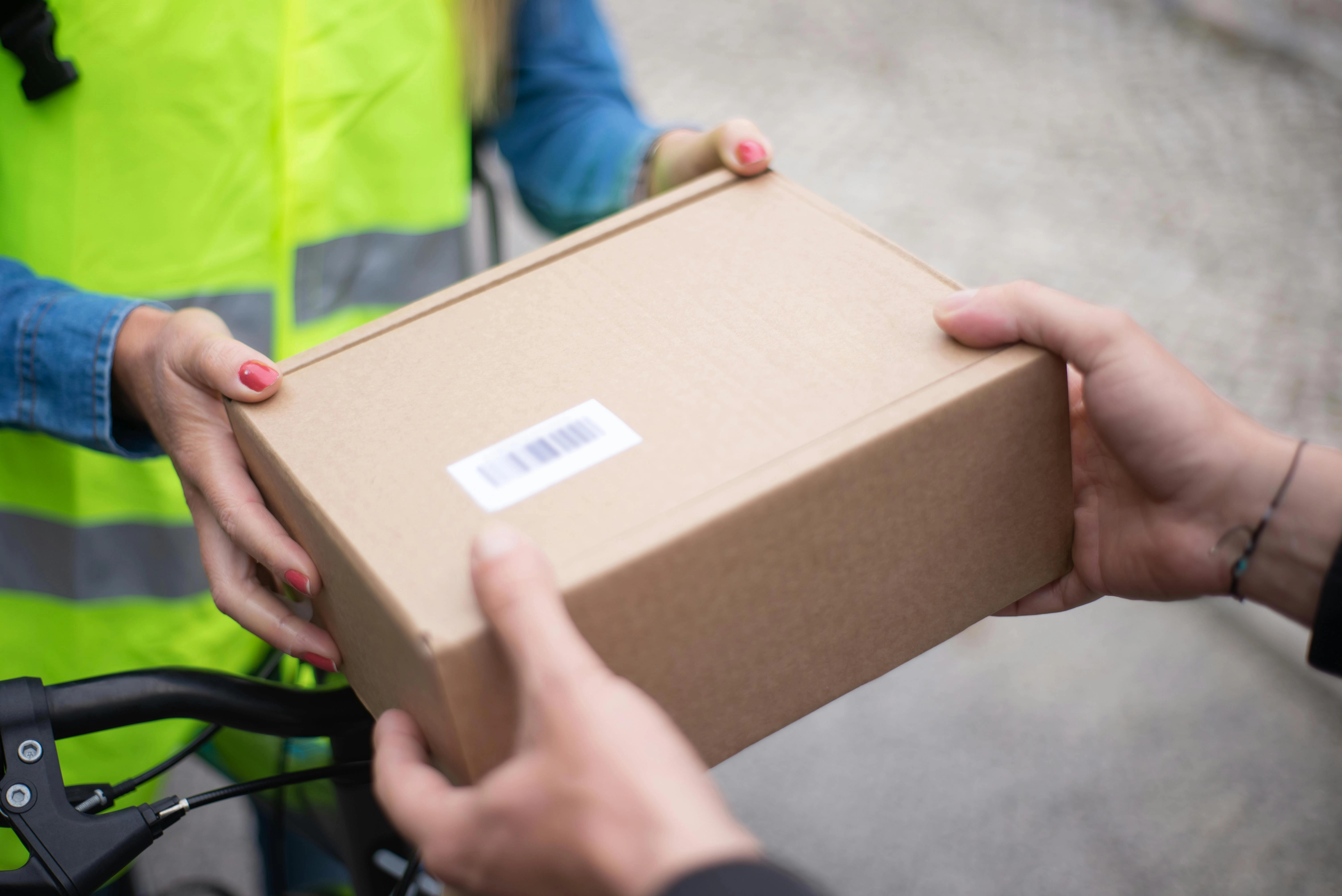 Package delivery handoff closeup