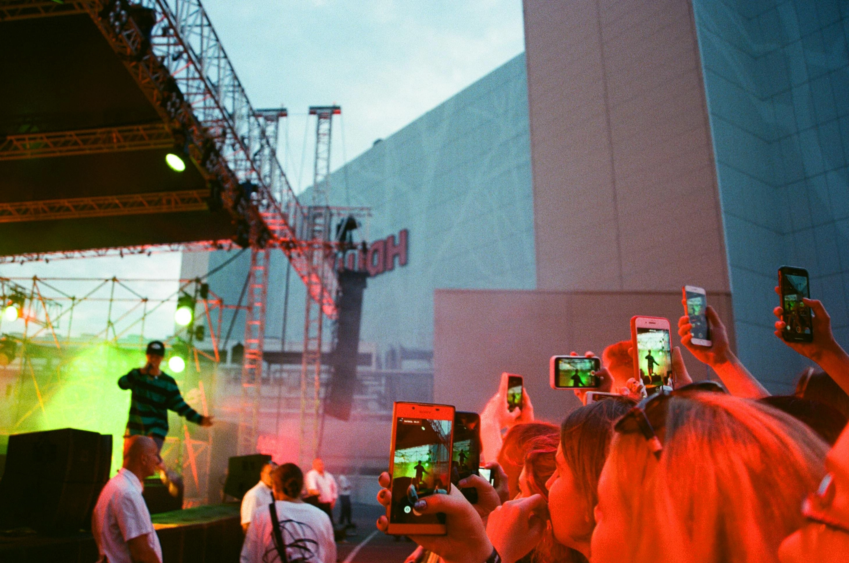 Concert crowd filming performance Concert crowd filming performance