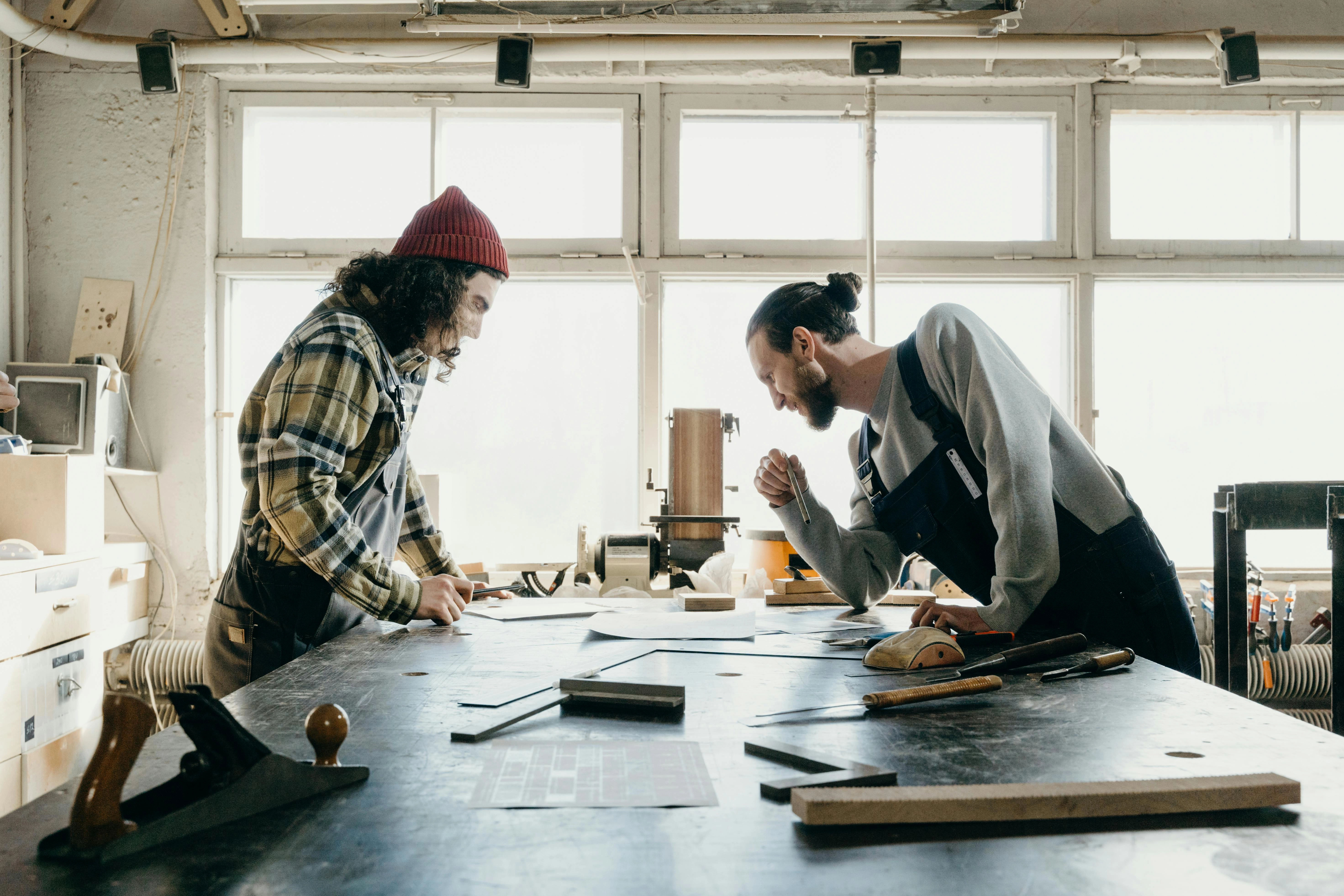 Craftsmen Collaborating in Workshop