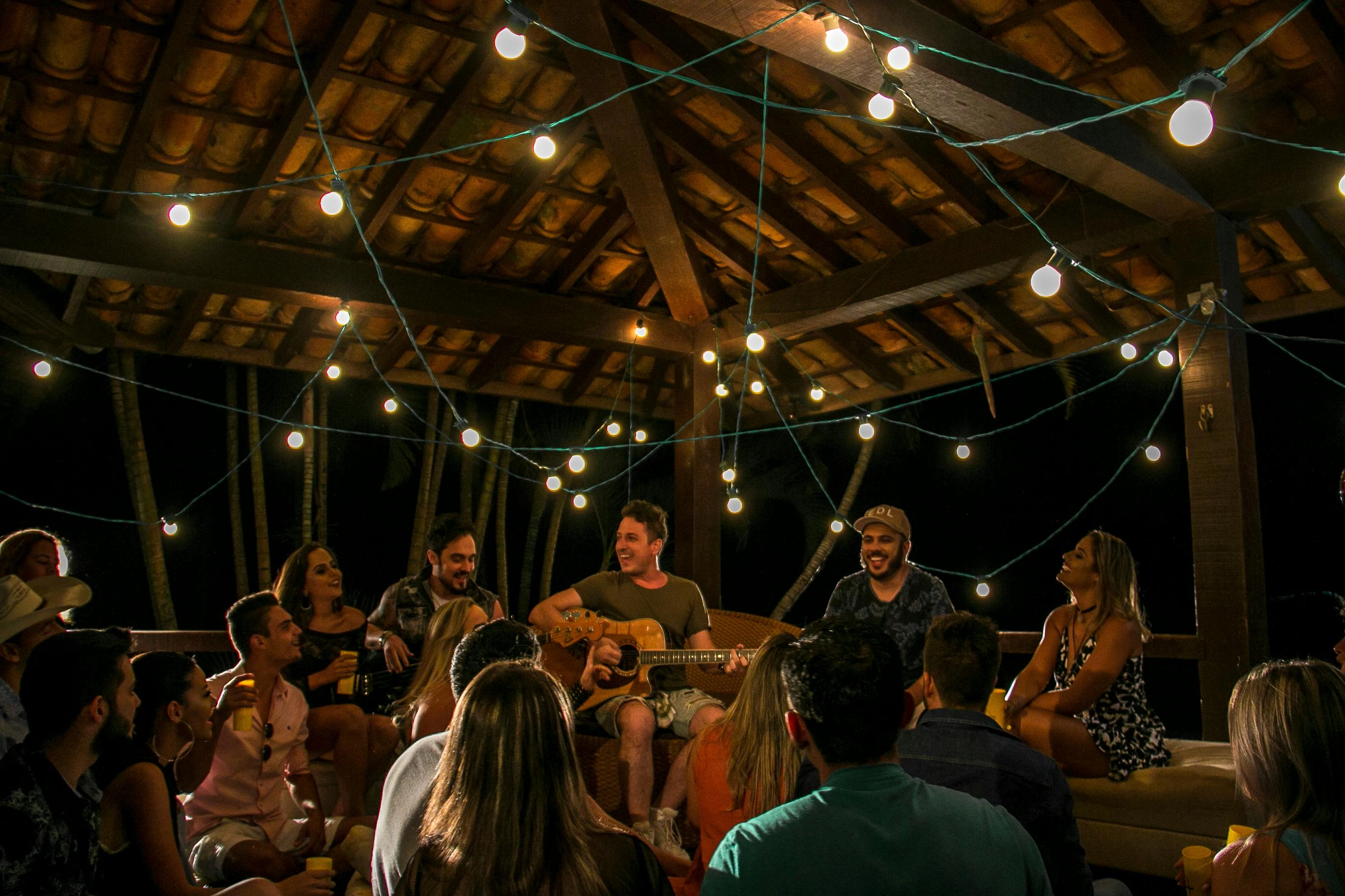 Festive gathering under string lights