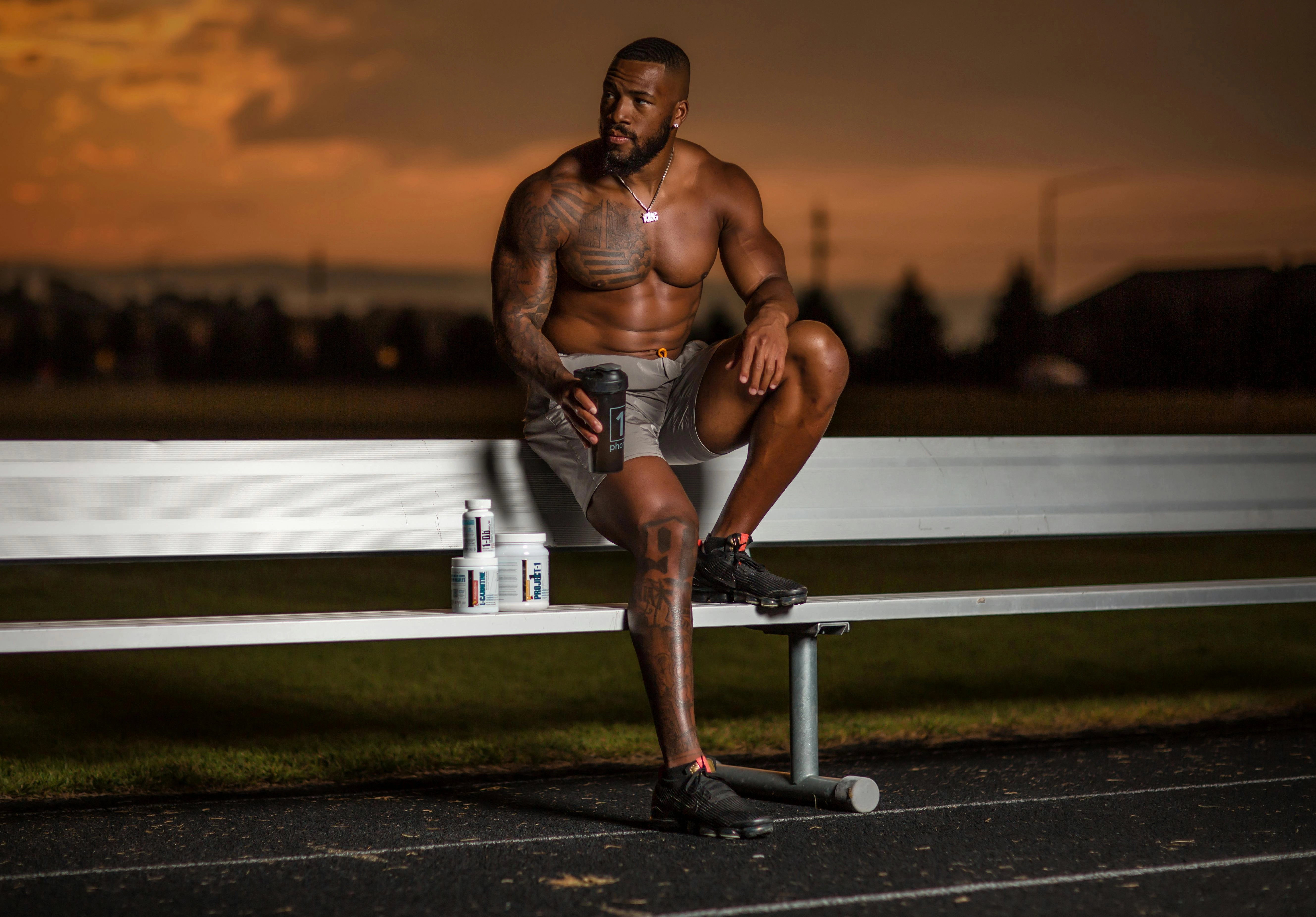 Muscular athlete at sunset Muscular athlete at sunset