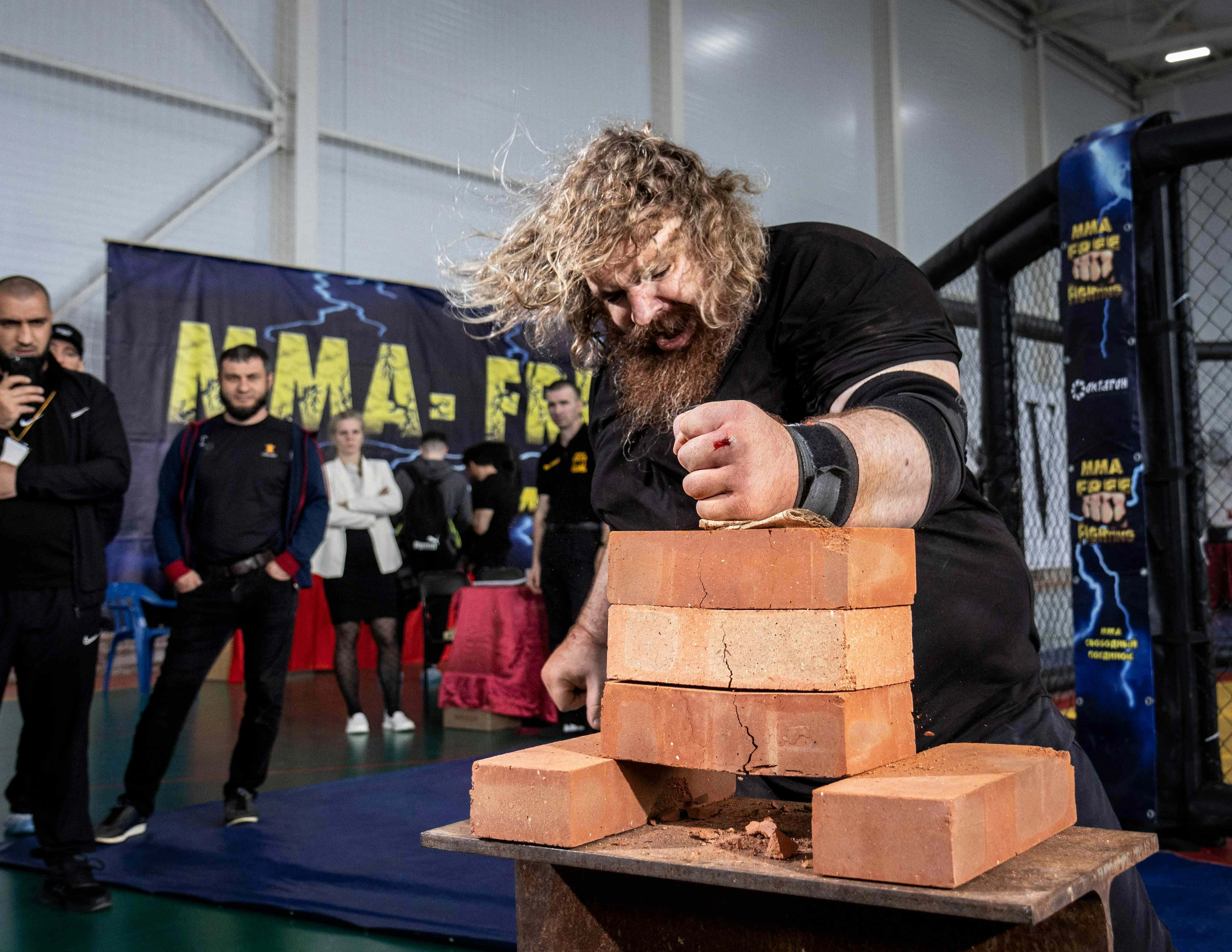 Strongman Breaking Bricks Performance Strongman Breaking Bricks Performance