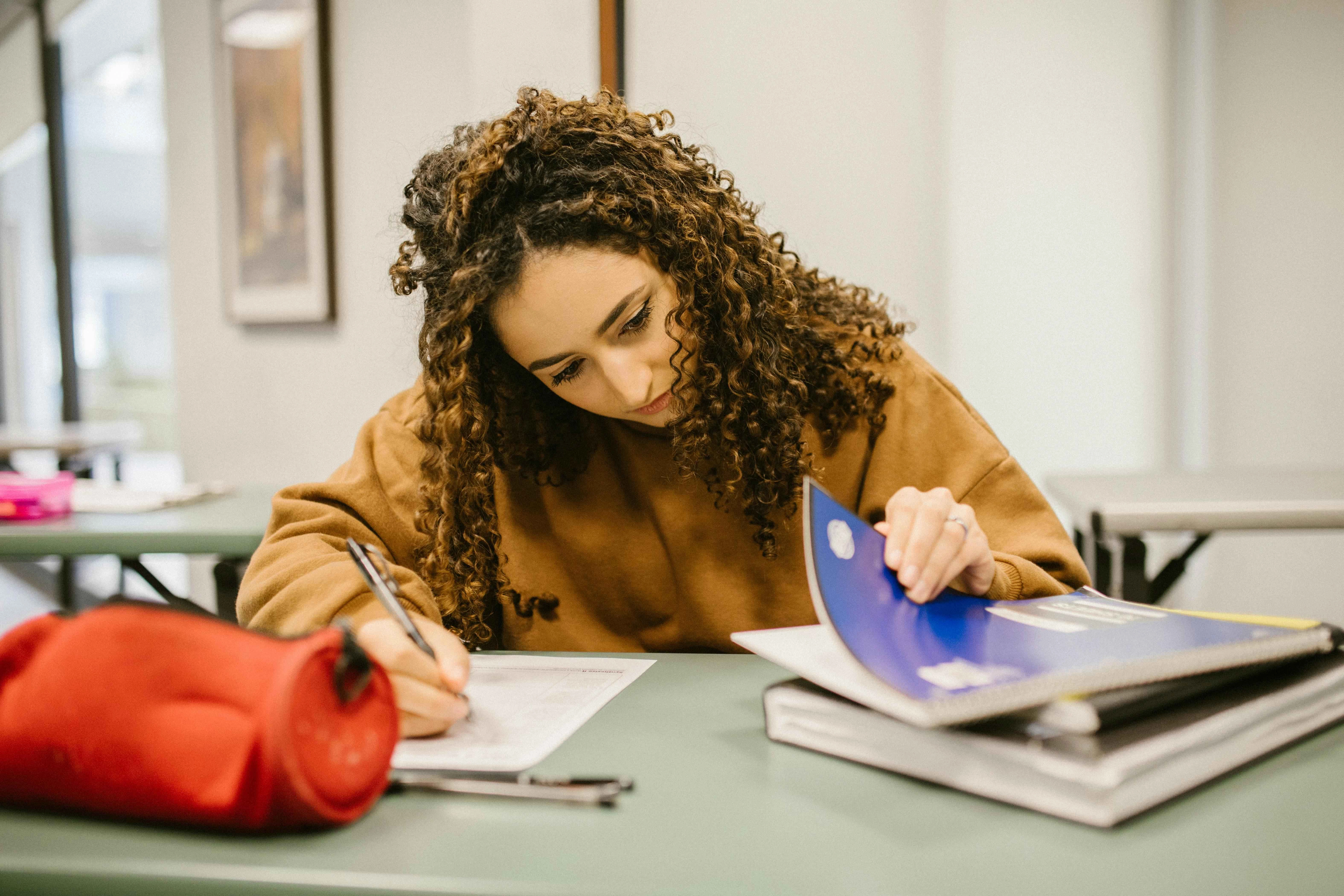 Student Studying with Curly Hair