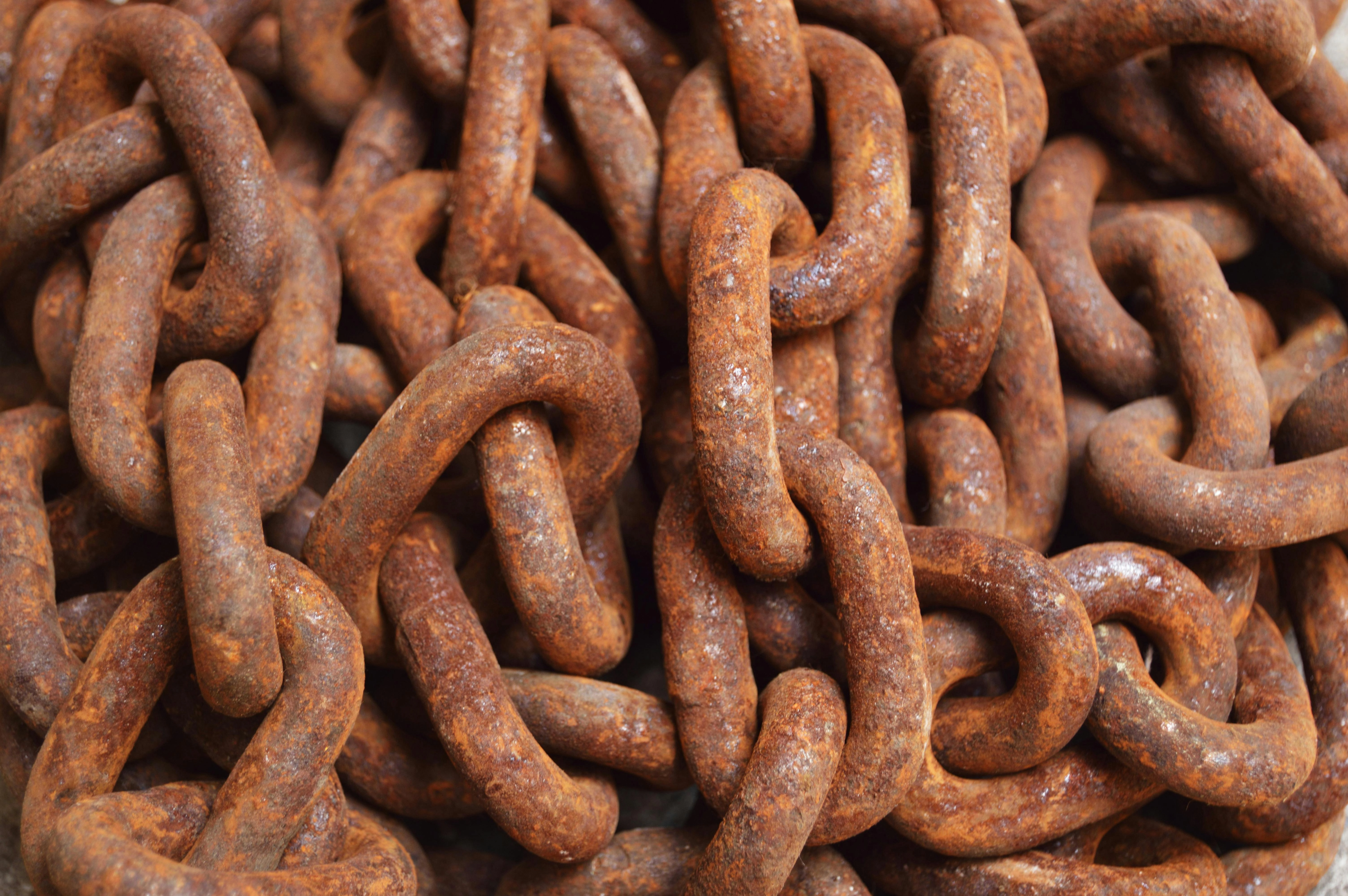 Rusty Interlinked Chain Closeup Rusty Interlinked Chain Closeup