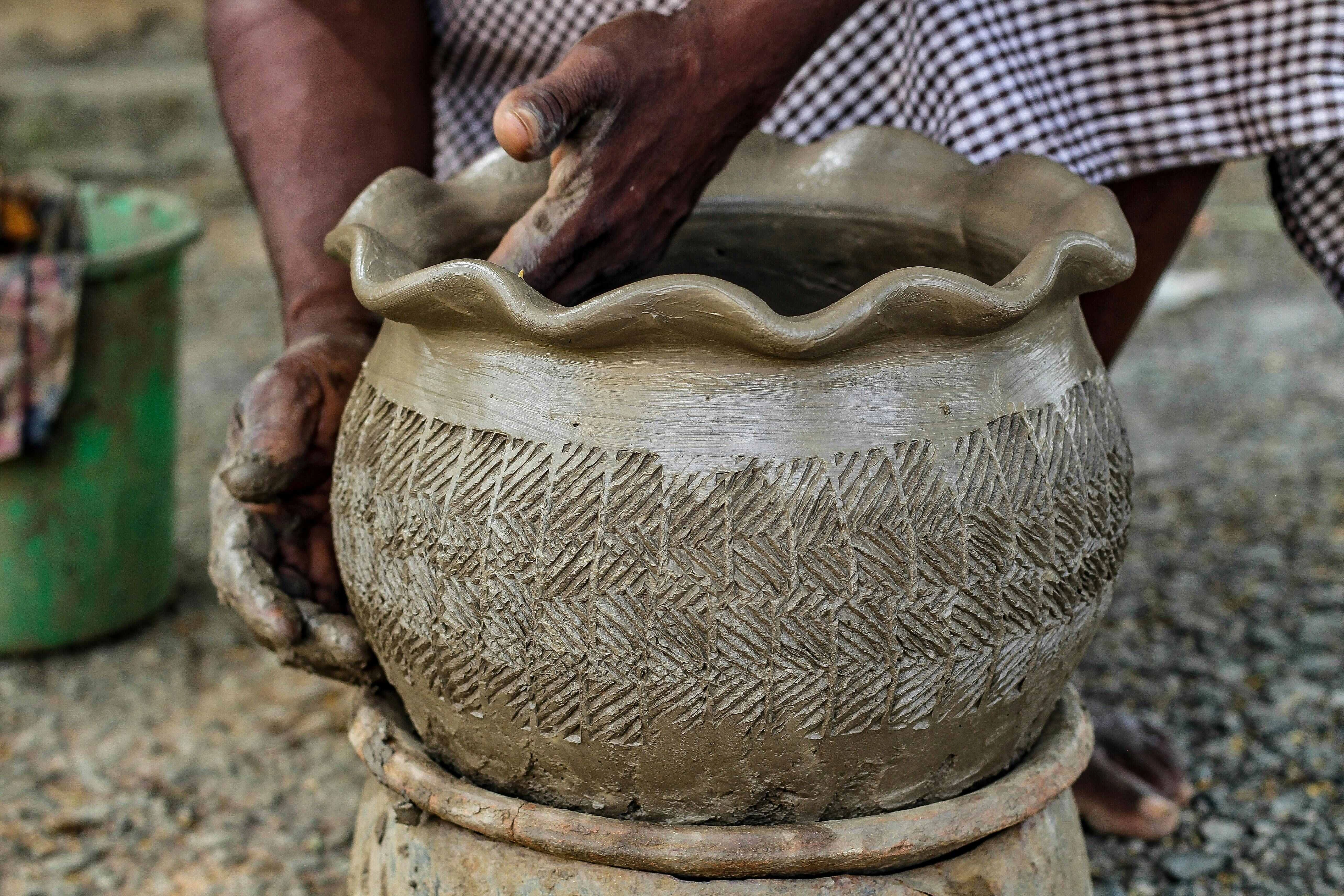Artisan Crafting Clay Pot