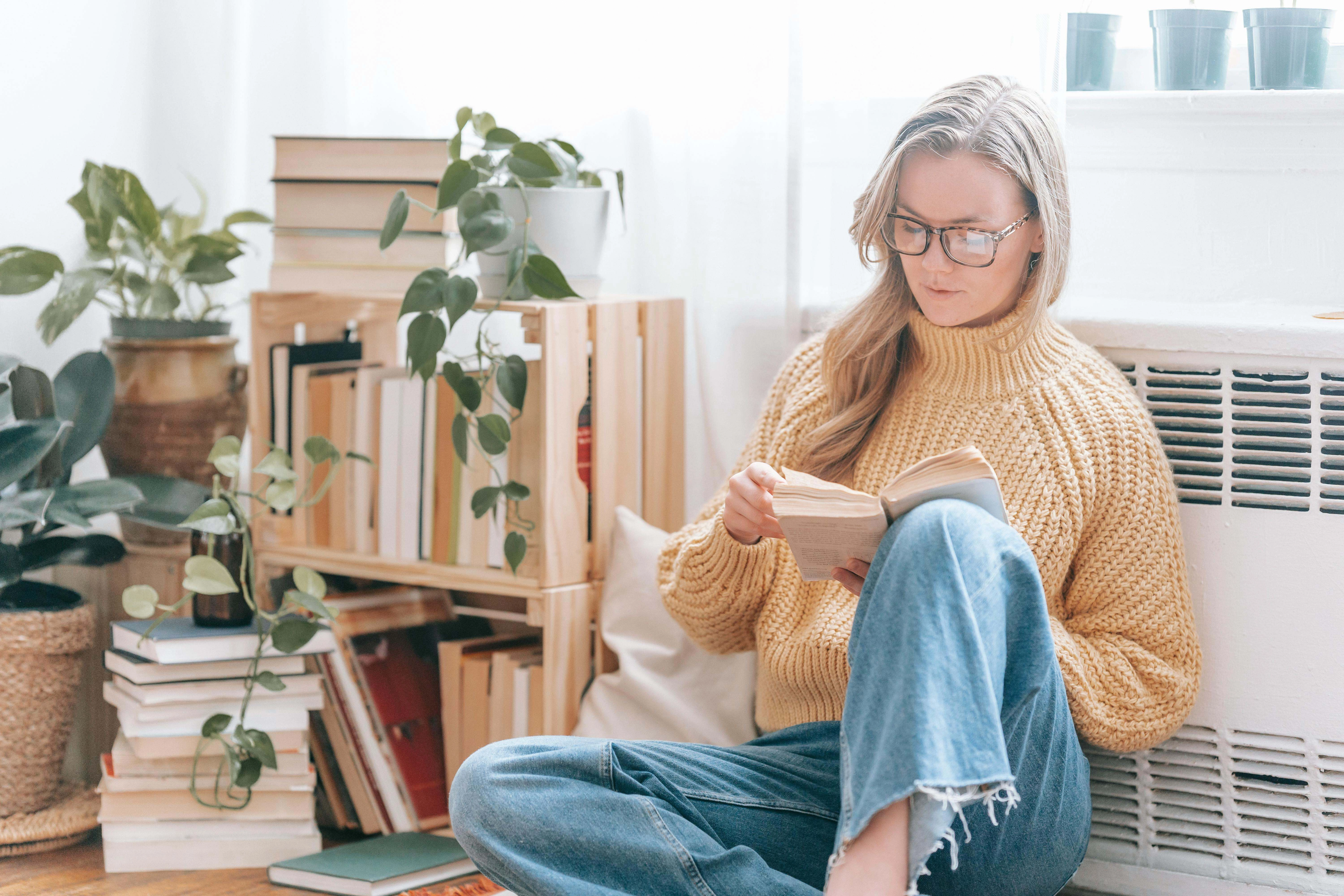 Woman Reading in Plant Nook