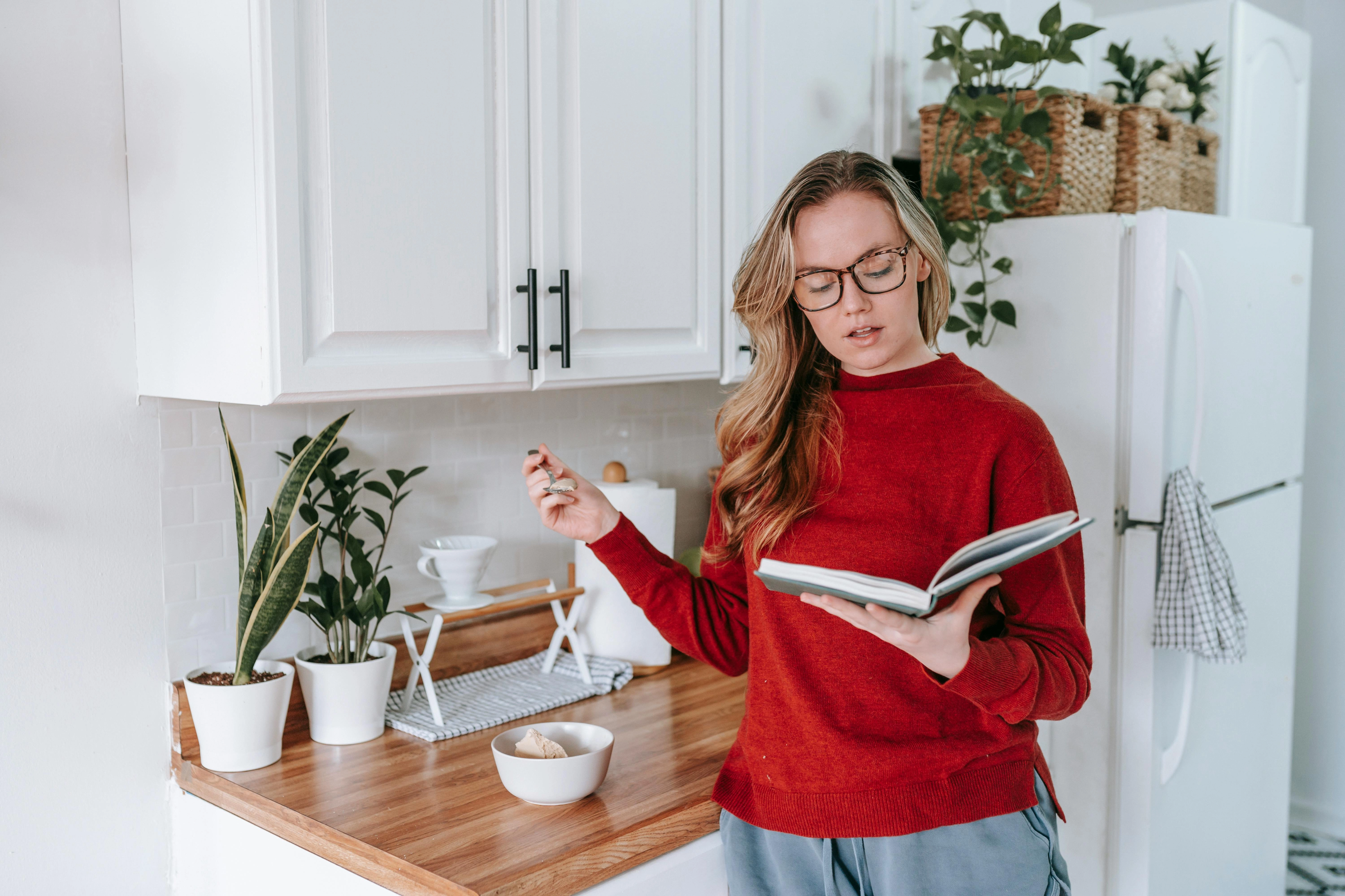 Woman Studying Recipe Book Peacefully