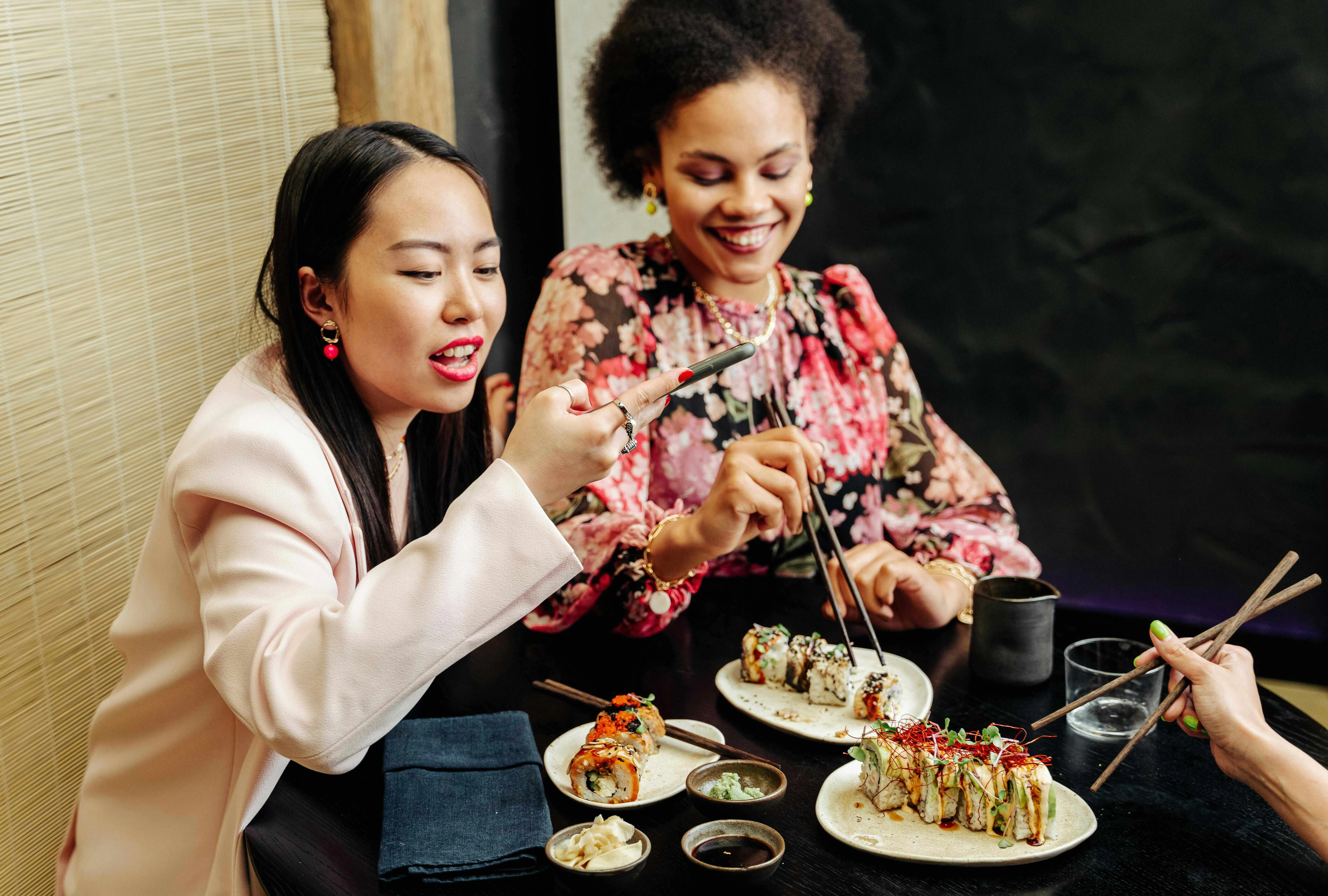 Diverse Friends Enjoying Sushi Dinner Diverse Friends Enjoying Sushi Dinner
