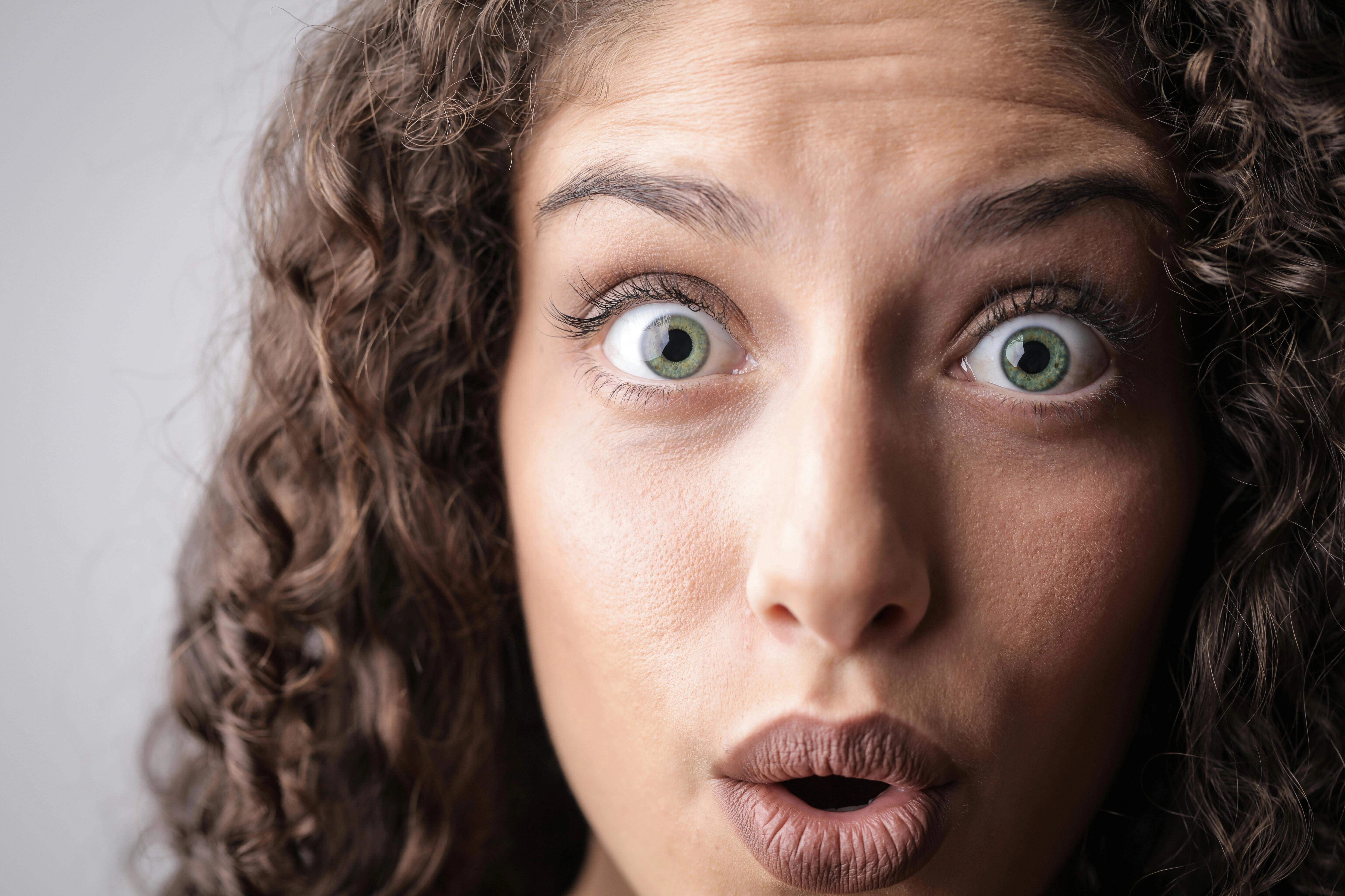 Surprised Wide-Eyed Curly-Haired Portrait Surprised Wide-Eyed Curly-Haired Portrait