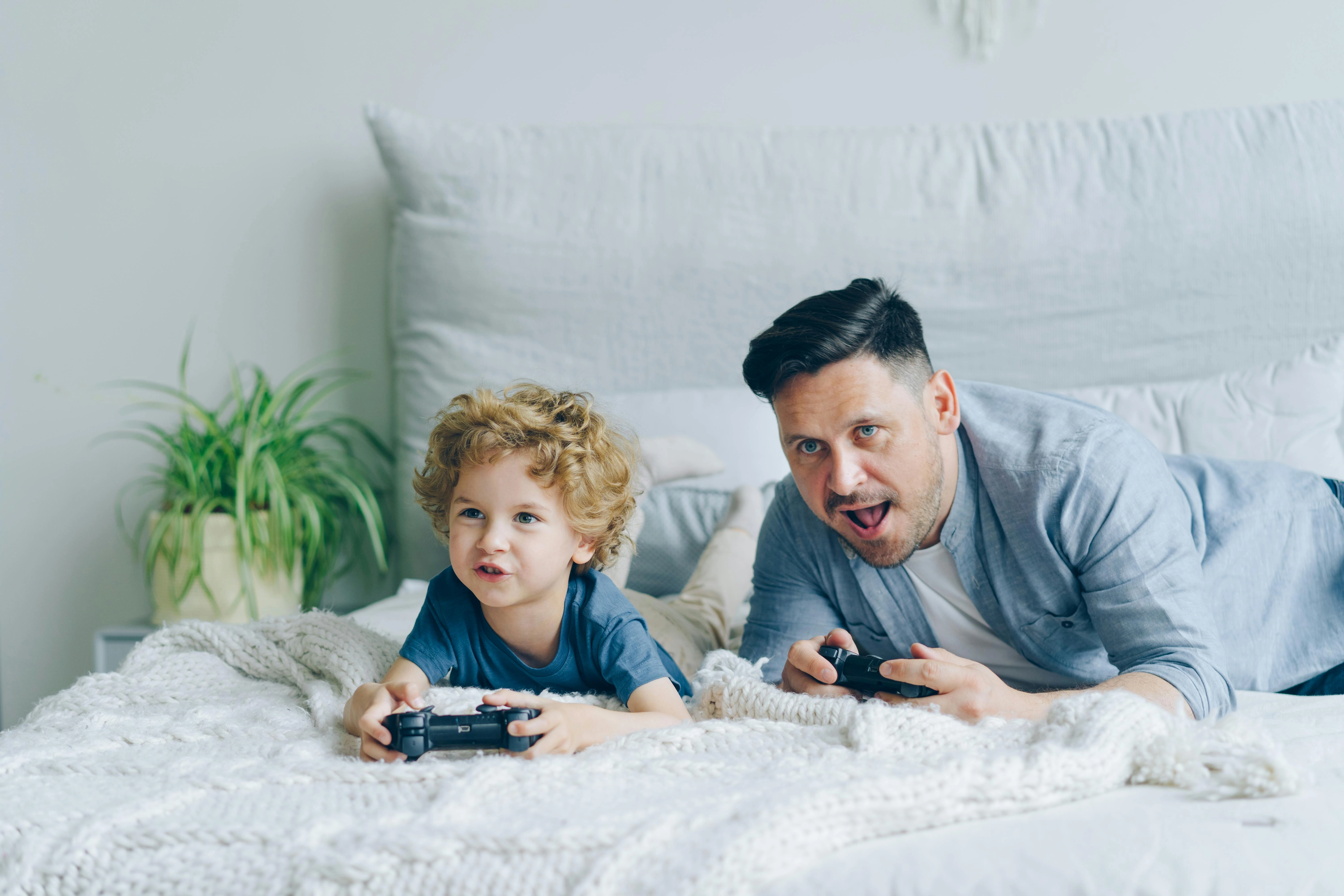 Father-son gaming bonding moment Father-son gaming bonding moment