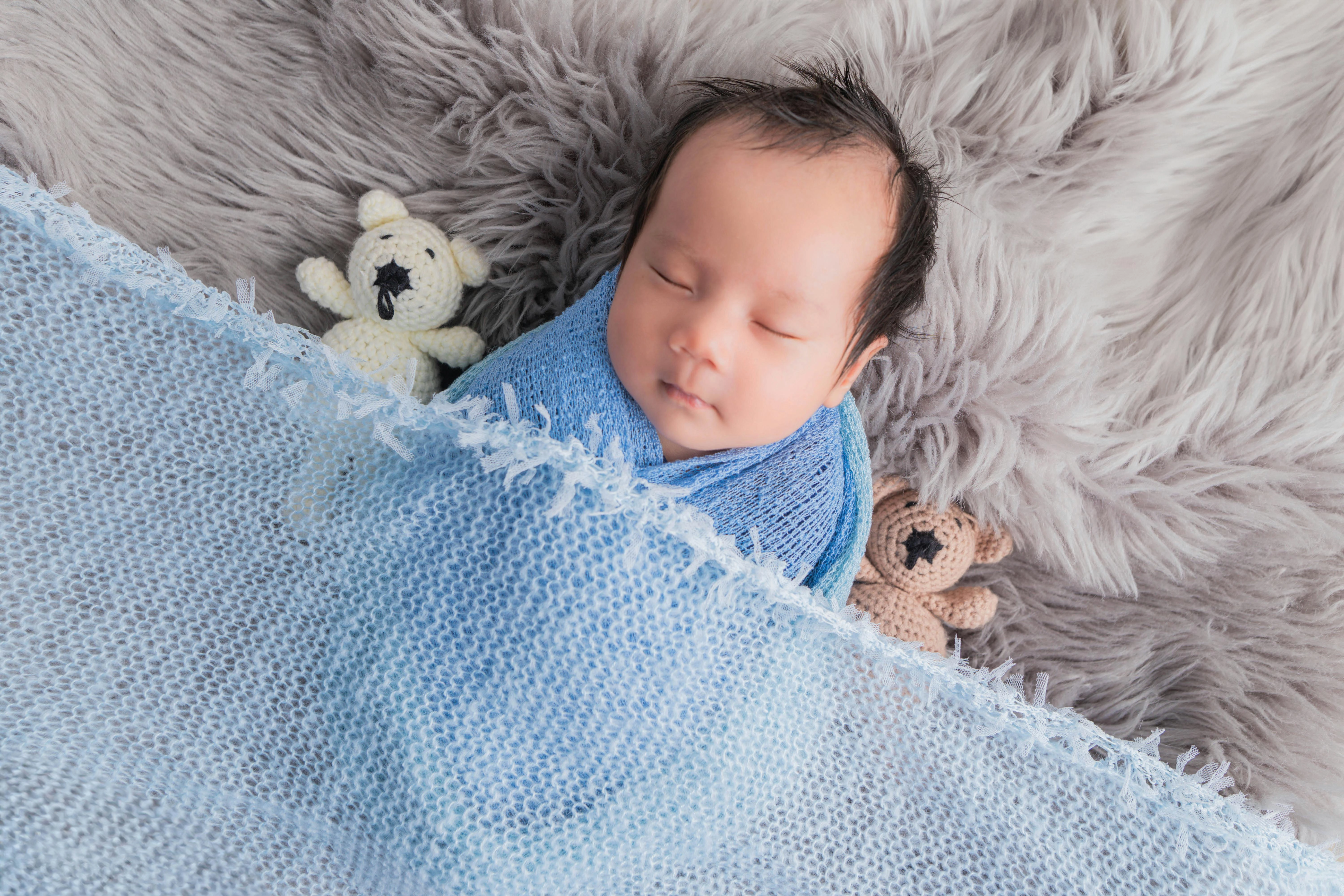 Peaceful Newborn with Teddy Bears Peaceful Newborn with Teddy Bears