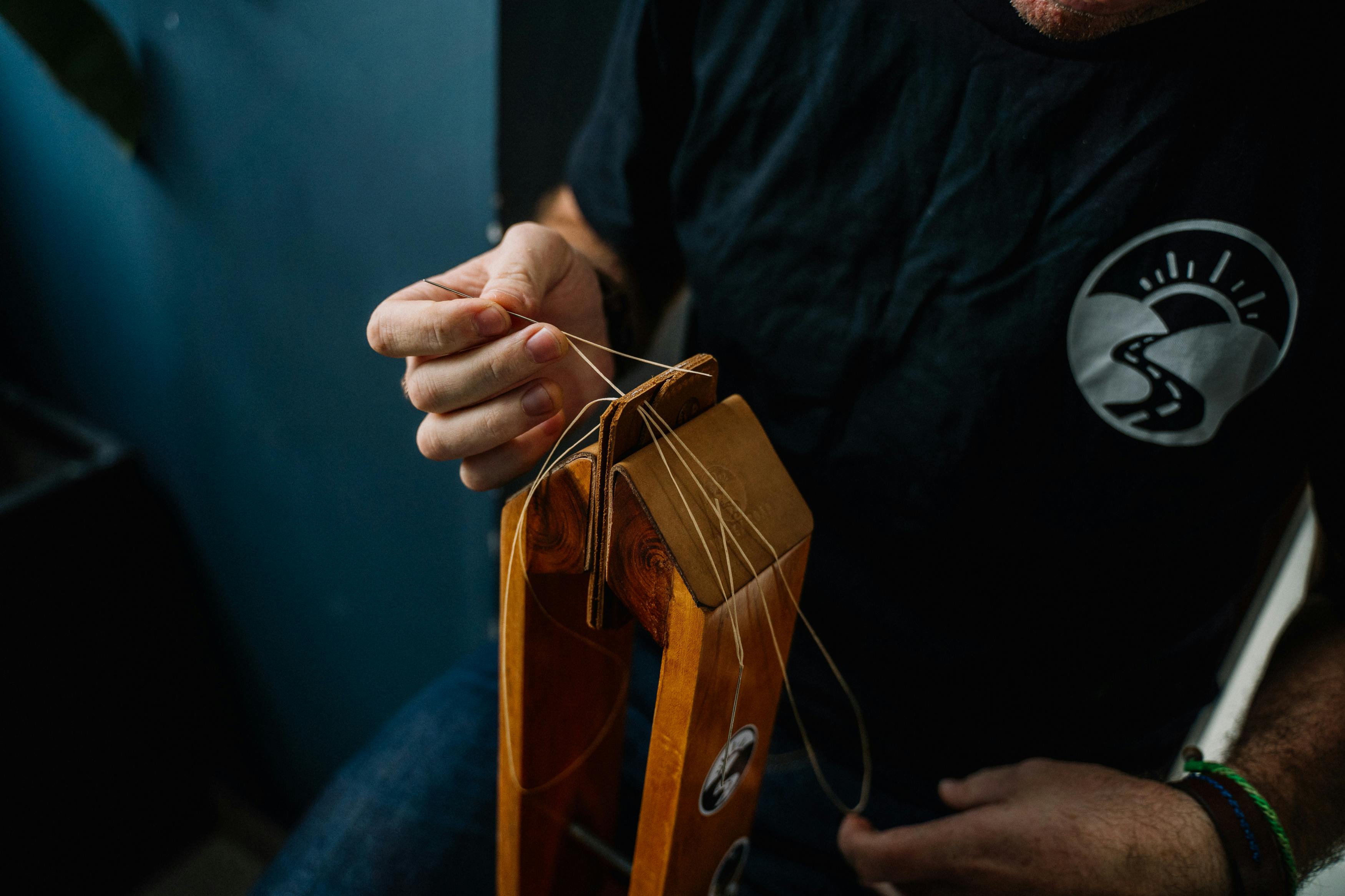 Luthier Restringing Guitar Headstock Luthier Restringing Guitar Headstock