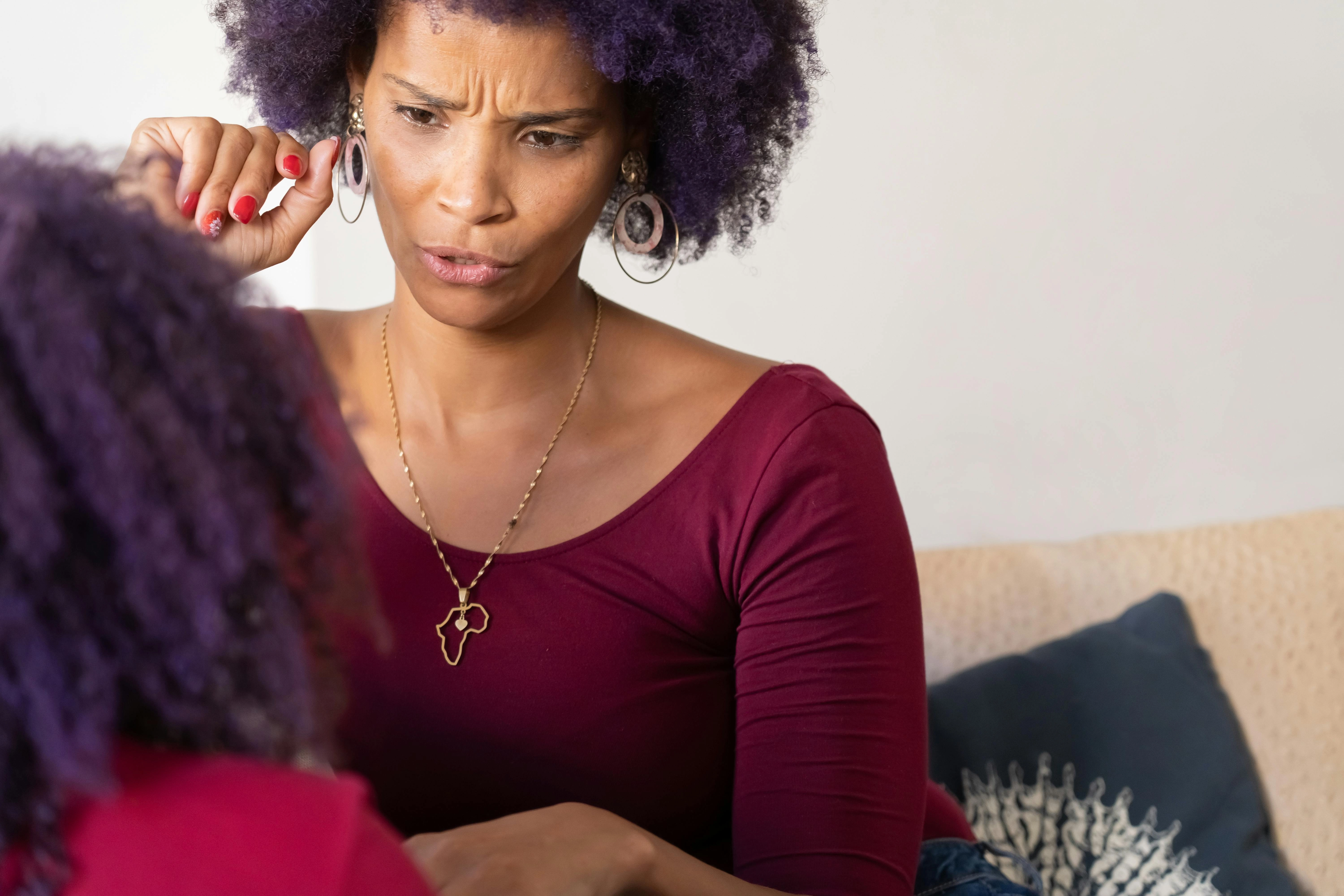Concerned Woman with Purple Hair