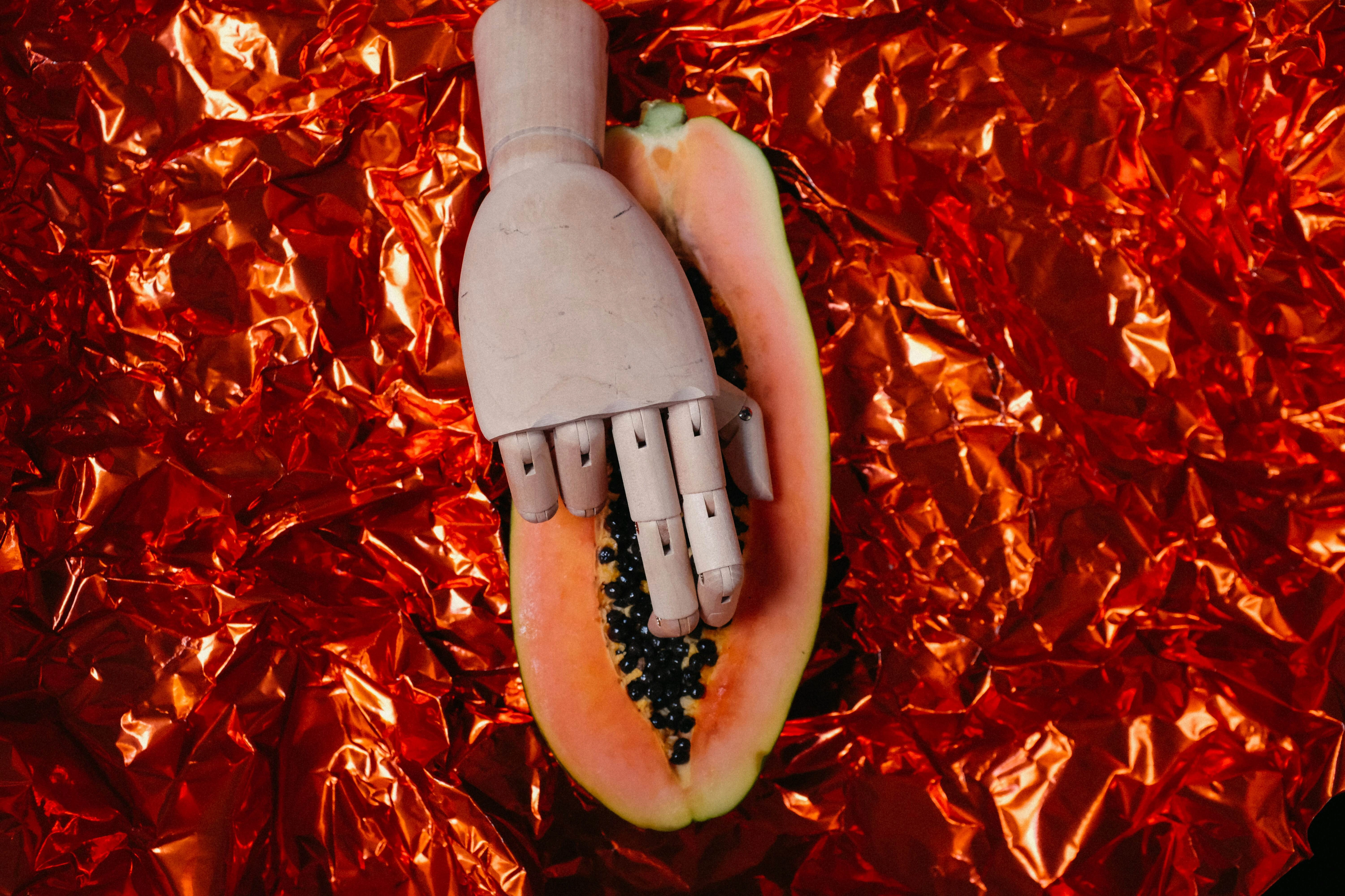 Robotic Hand Caressing Papaya