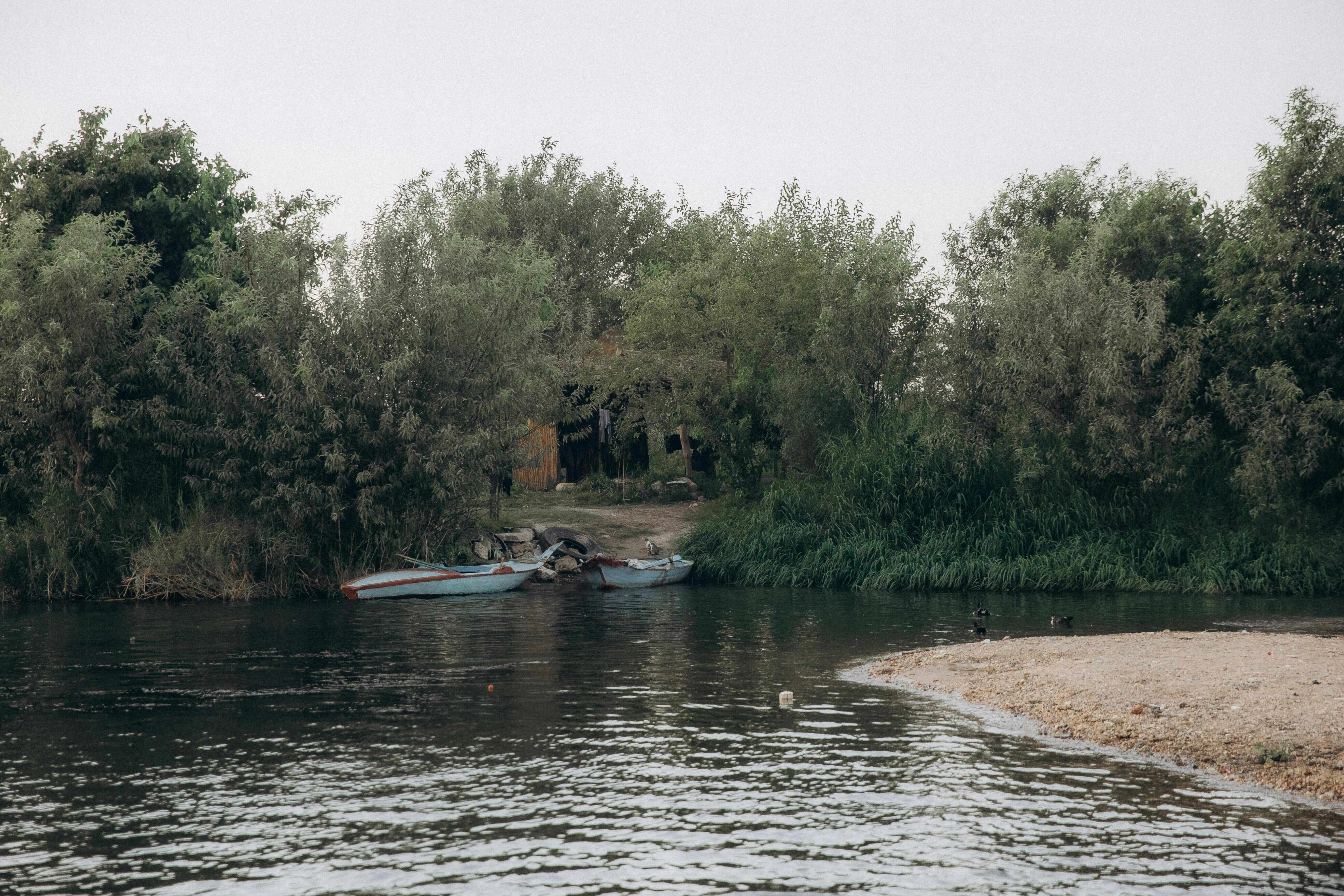 Tranquil Riverside Boat Scene Tranquil Riverside Boat Scene
