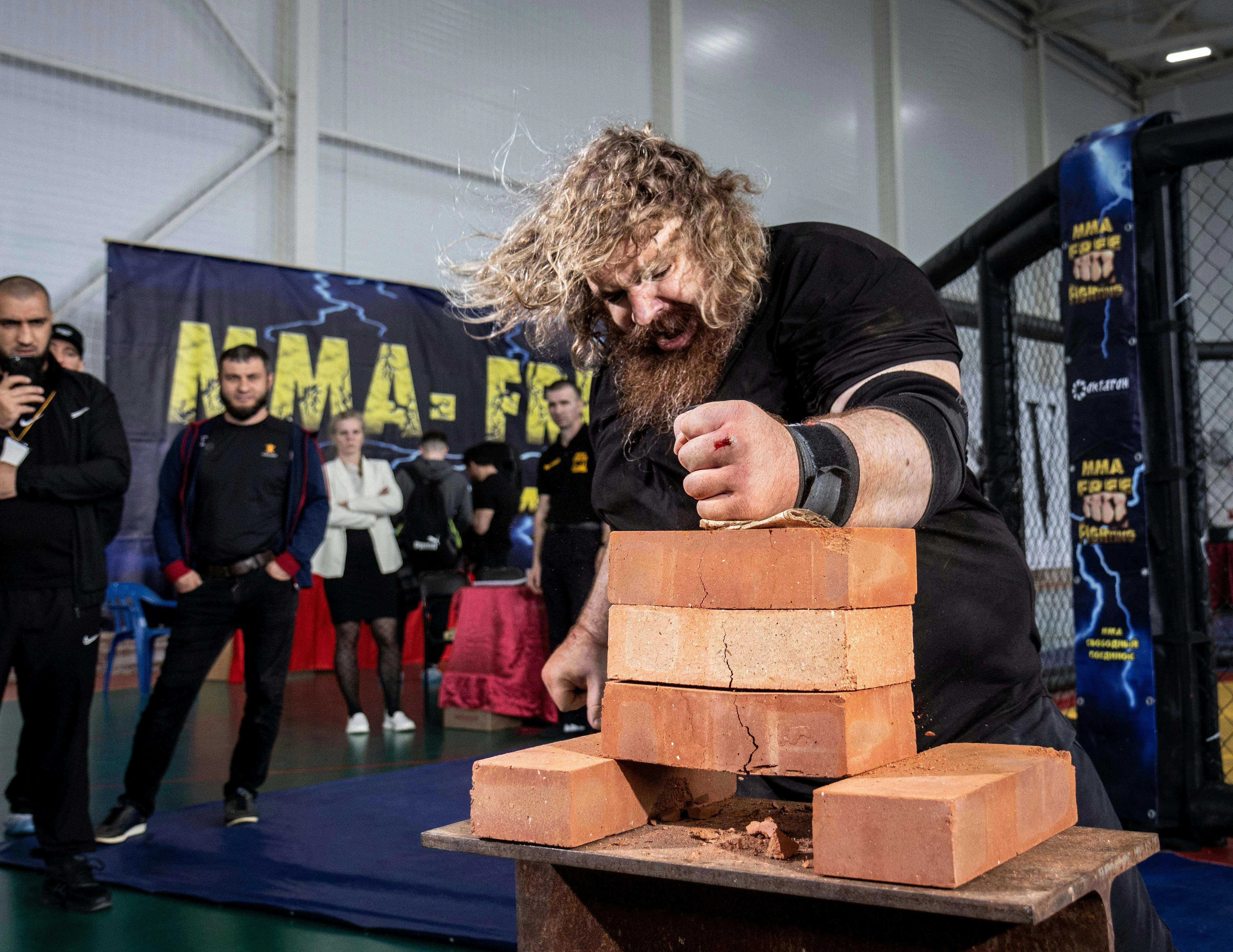 Strongman Breaking Bricks Demonstration Strongman Breaking Bricks Demonstration
