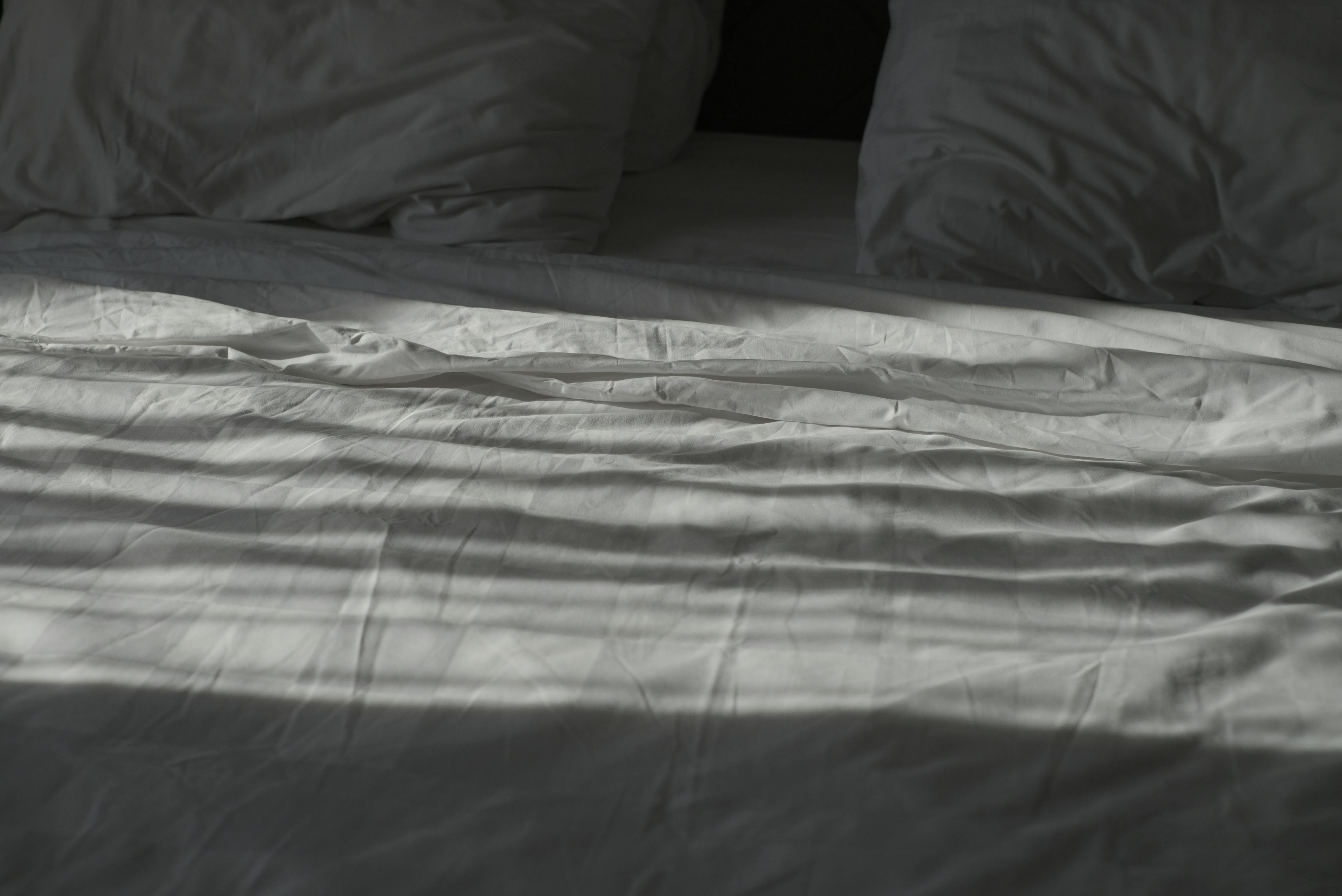 Sunlit Rumpled Bed Sheets