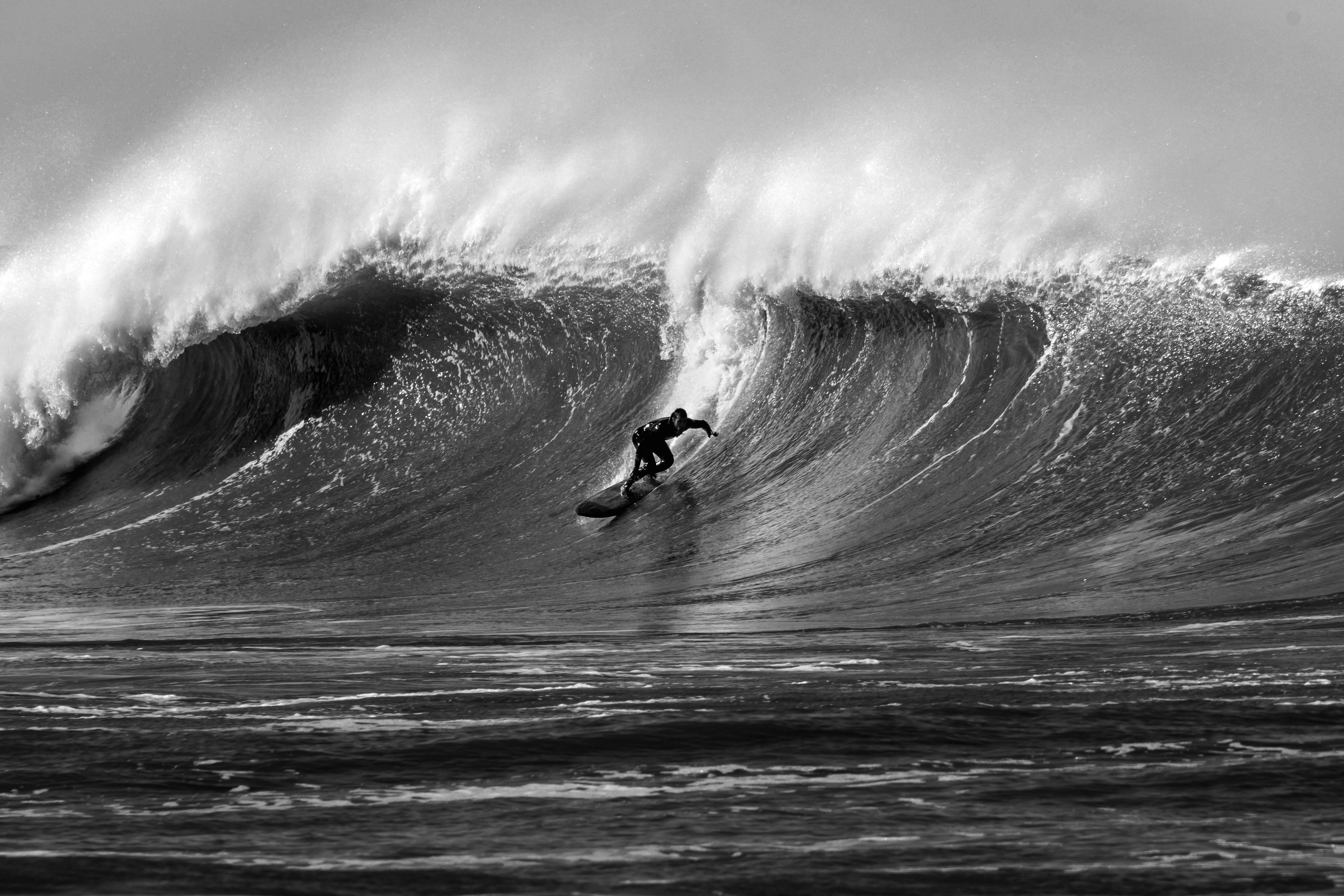 Surfer Riding Massive Wave