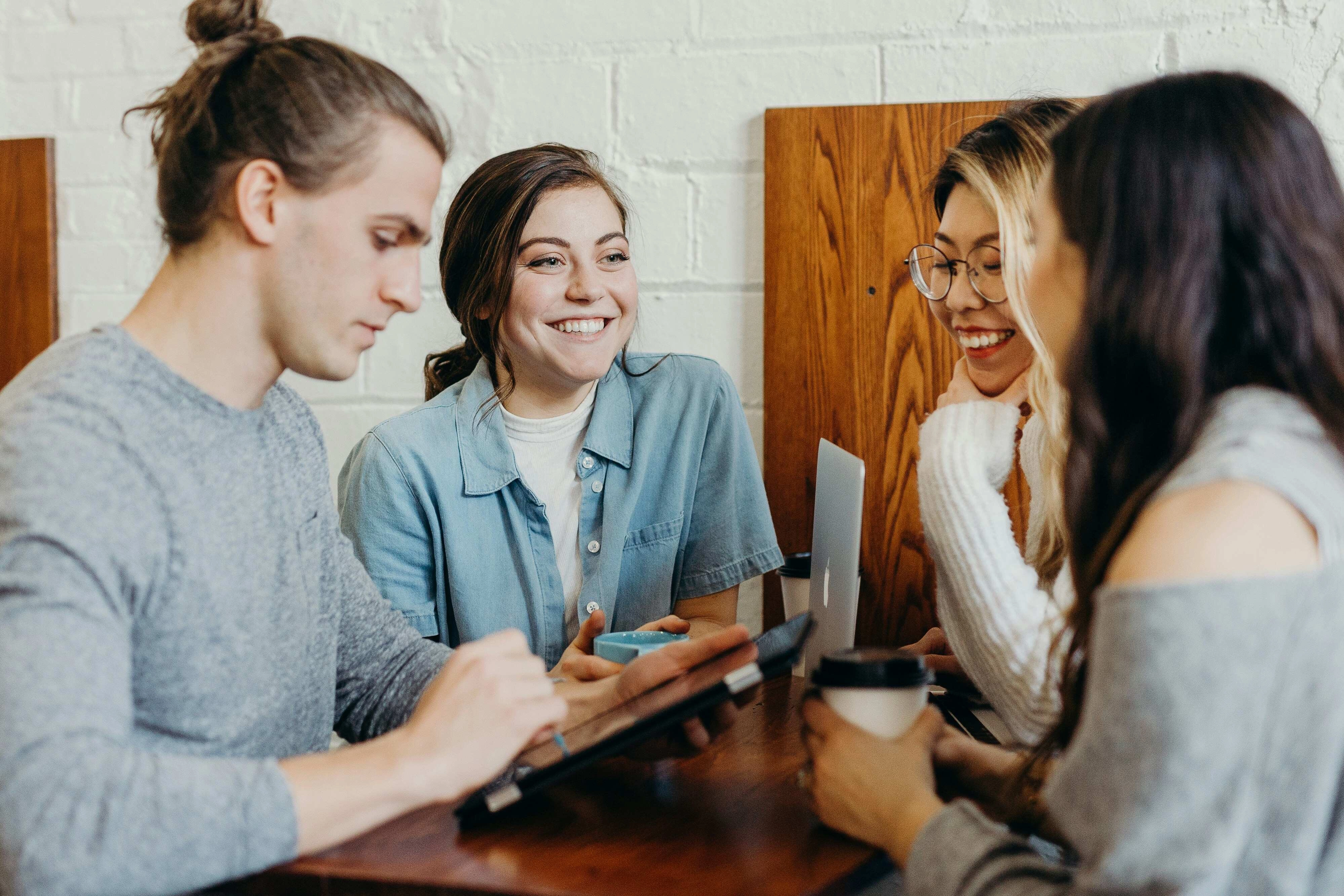 A group of friends at a coffee shop A group of friends at a coffee shop