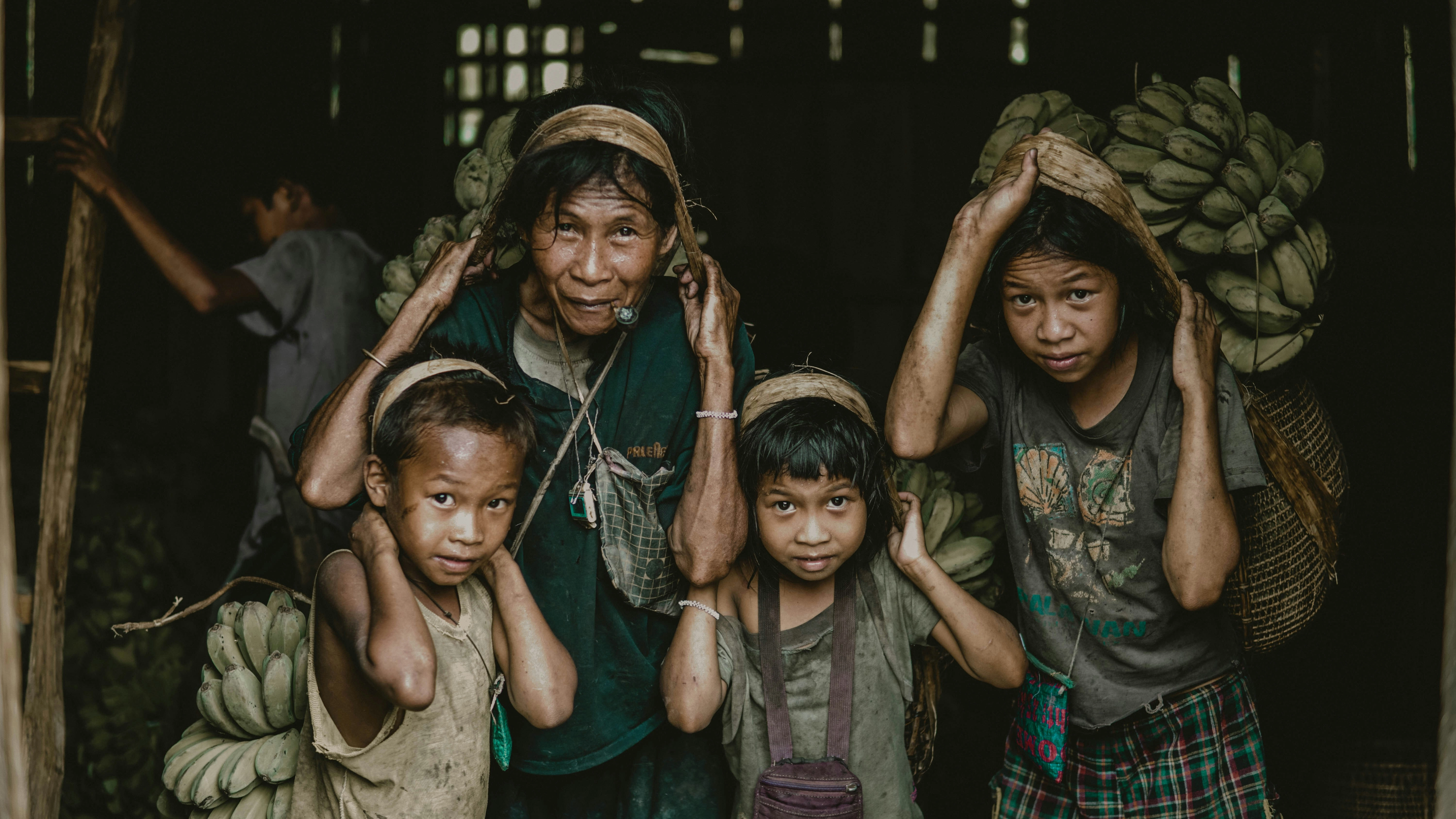 Family Carrying Banana Harvest