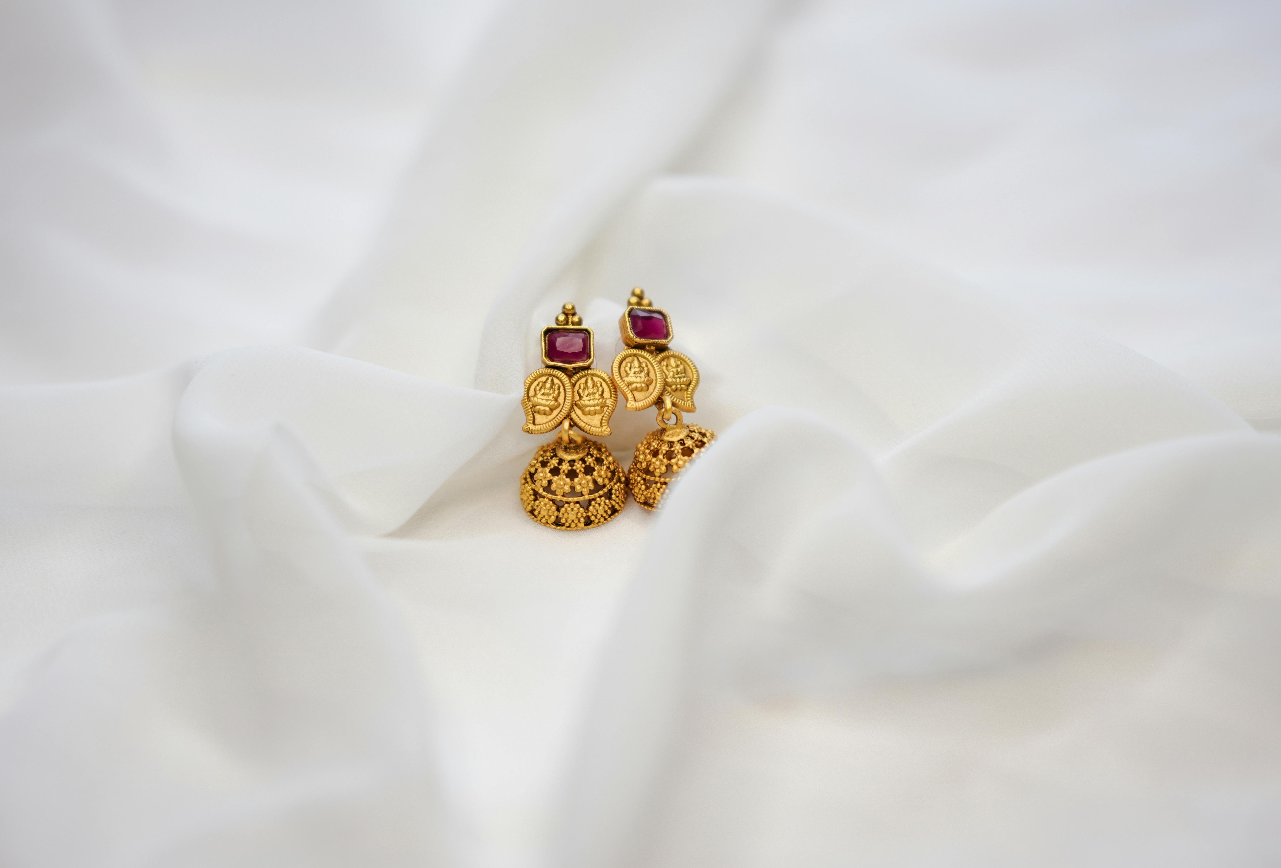 Ornate Golden Jhumka Earrings