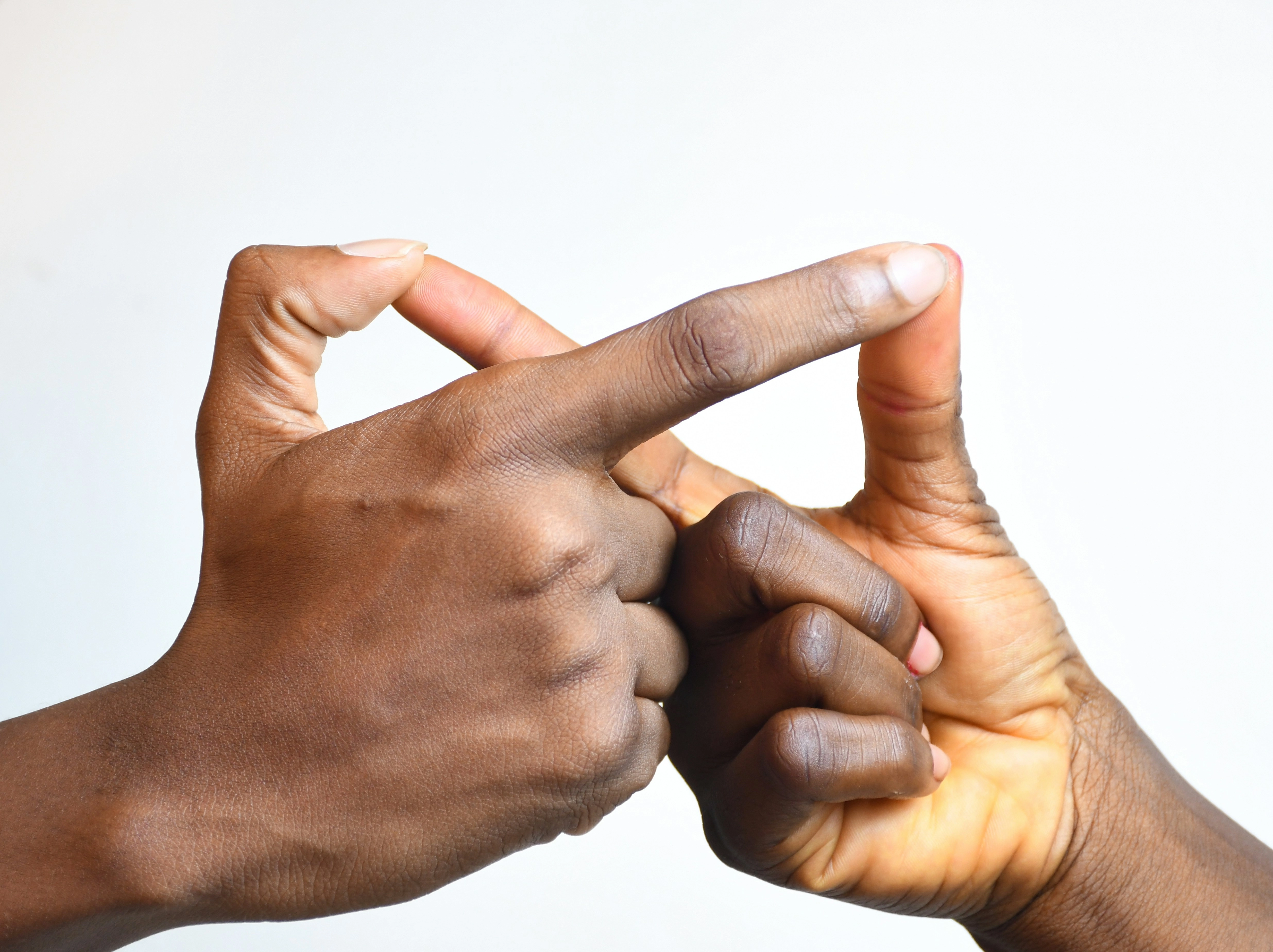 Intertwined Hands Forming Triangle Intertwined Hands Forming Triangle