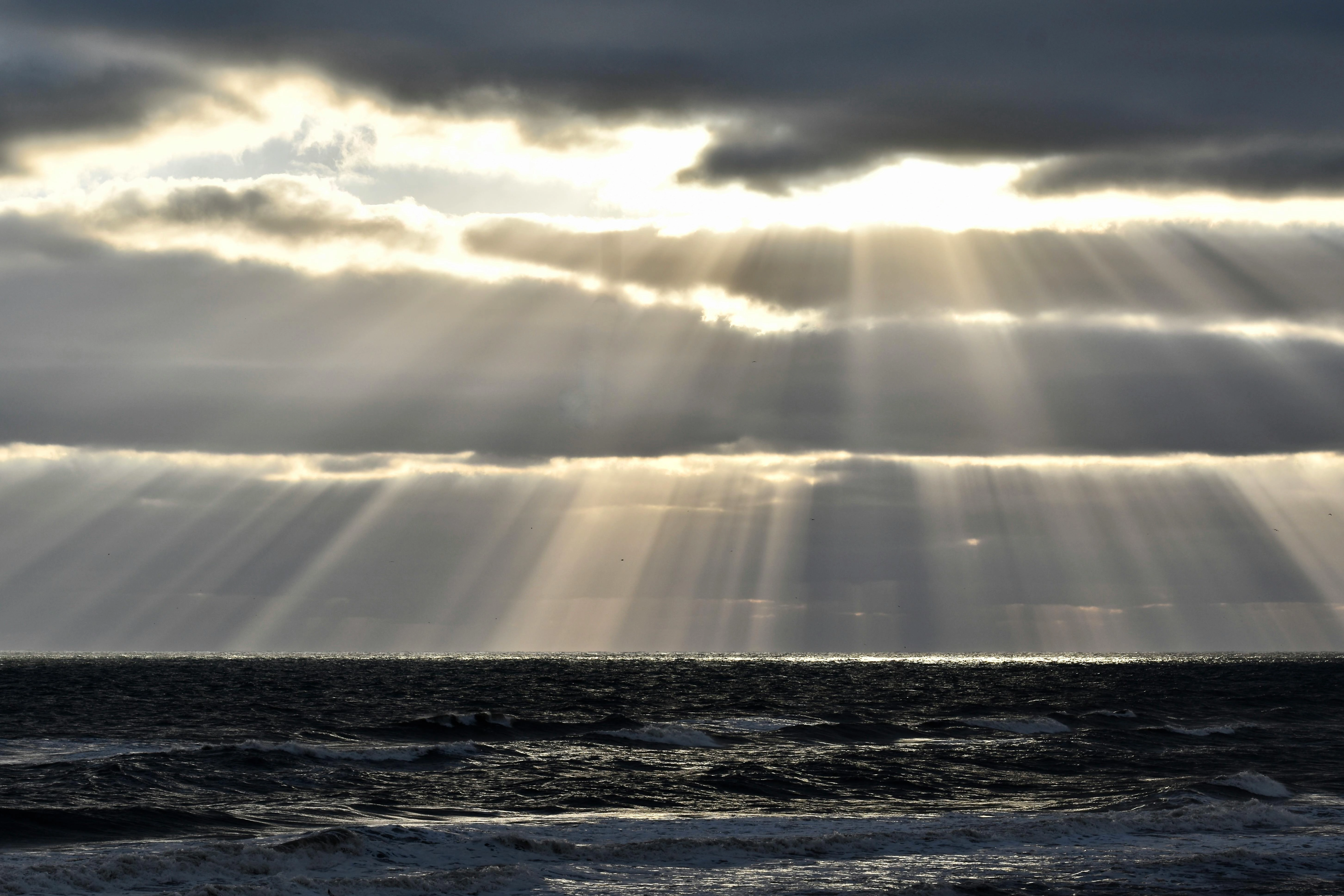 Sunbeams Over Stormy Sea